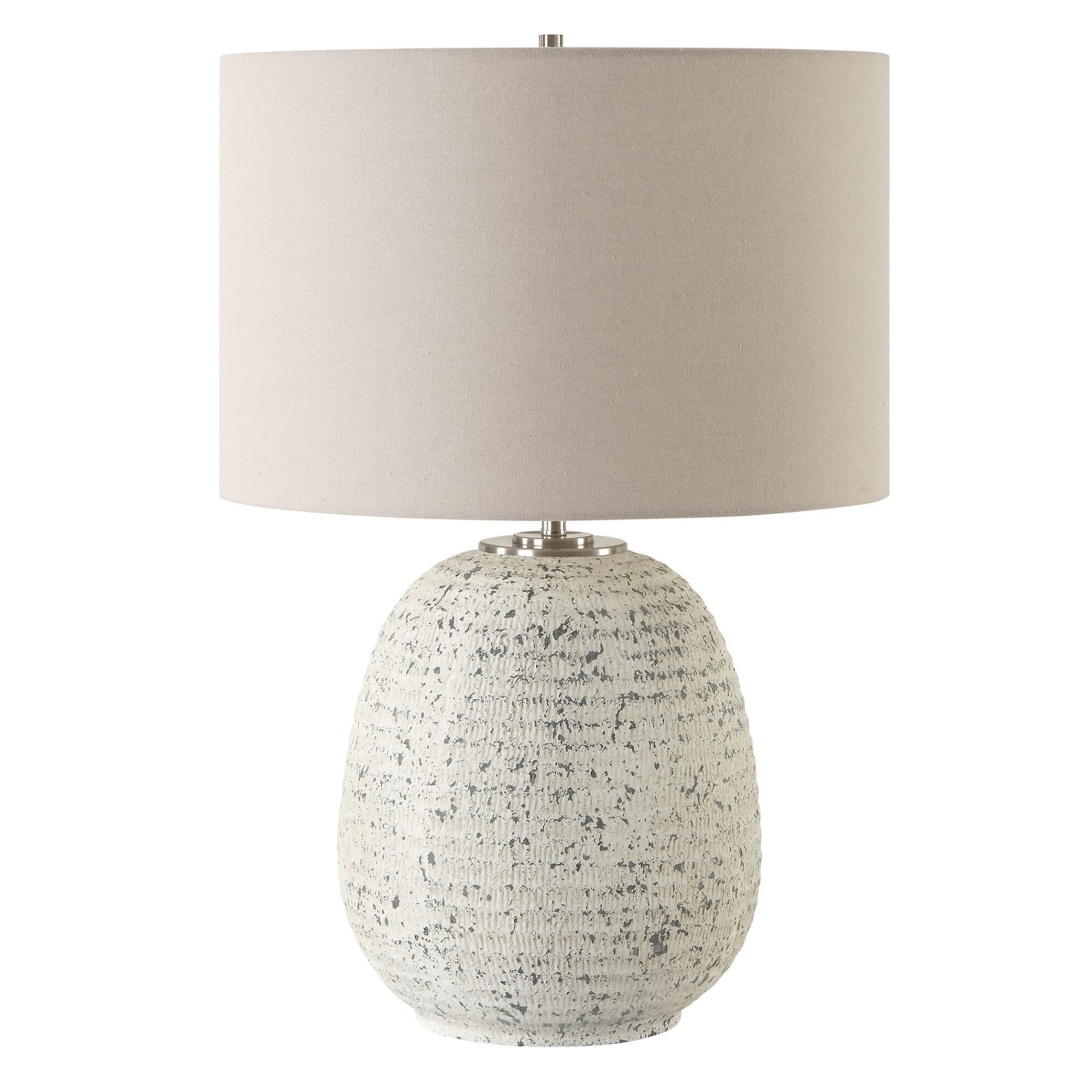 Shown in This Ceramic Table Lamp Boast A Ribbed Textured Surface Finished In A Heavily Distressed Stone Ivory finish and Round Drum Hardback shade