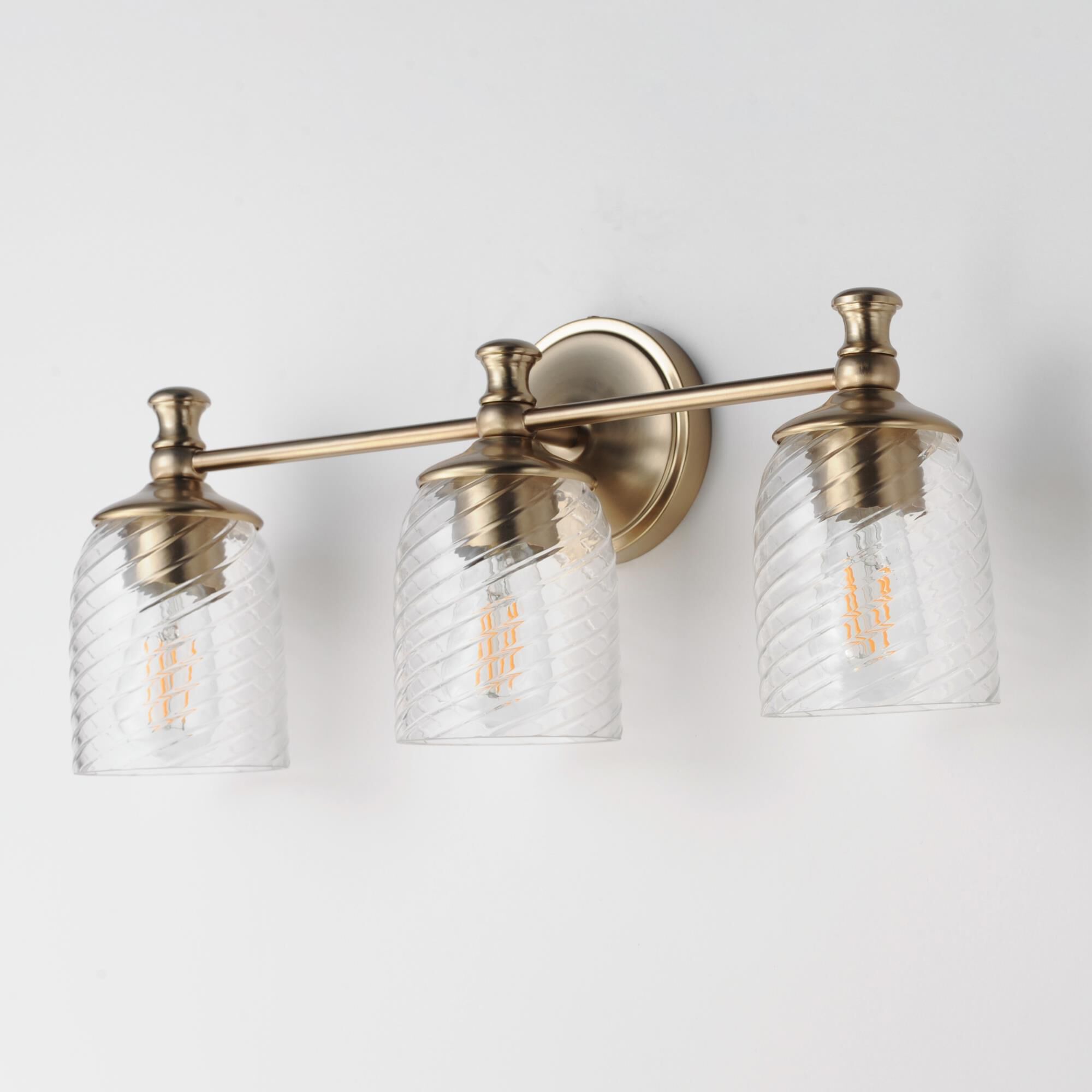 Shown in Satin Champagne finish and Clear Ribbed glass and Glass shade