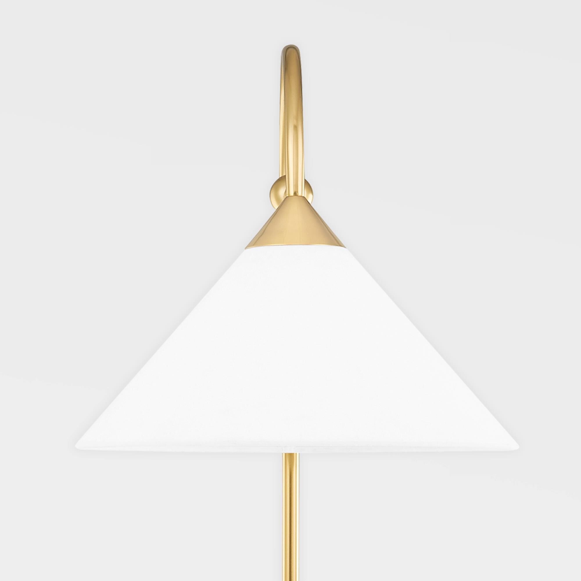 Shown in Aged Brass finish and White Linen shade