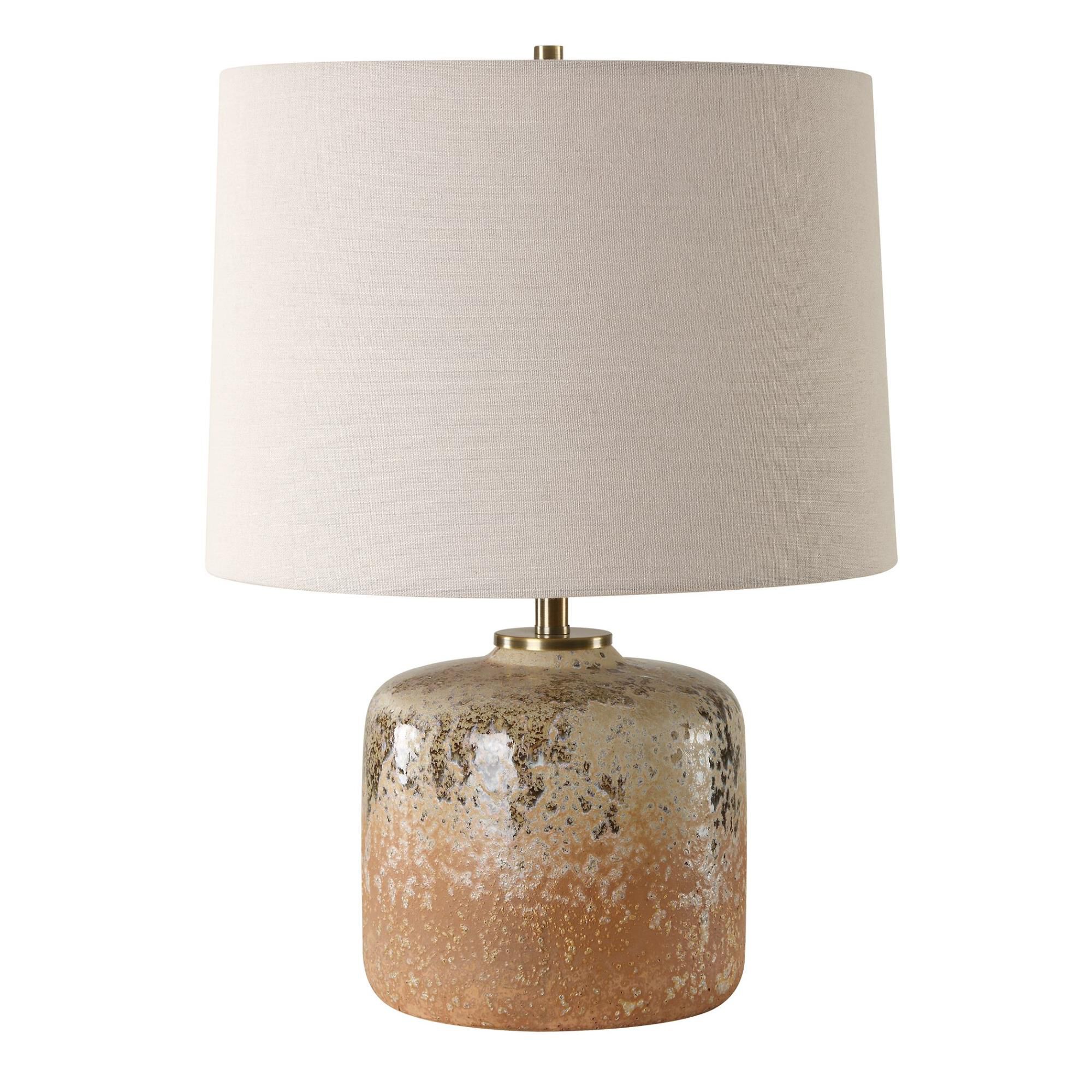 Shown in Bringing The Rustic Charm Of The West Indoors, The Canyon Table Lamp Features A Chocolate And Tan Mo finish and Round Hardback shade