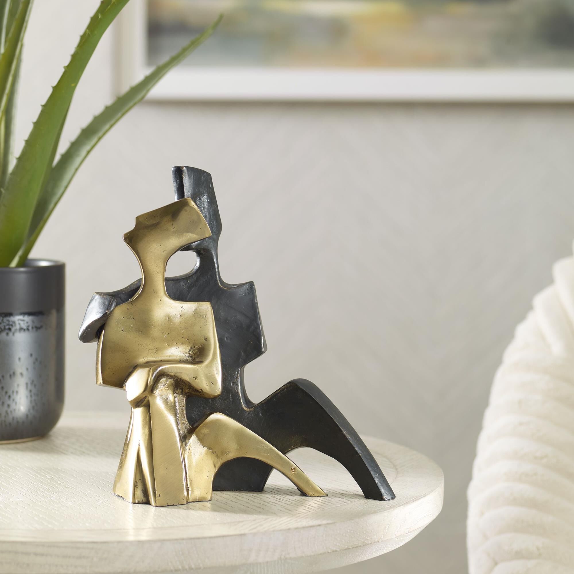 Shown in Capturing The Essence Of Love In Shimmering Bronze And Gold, Our Affectionate Couple Sculpture Evoke finish