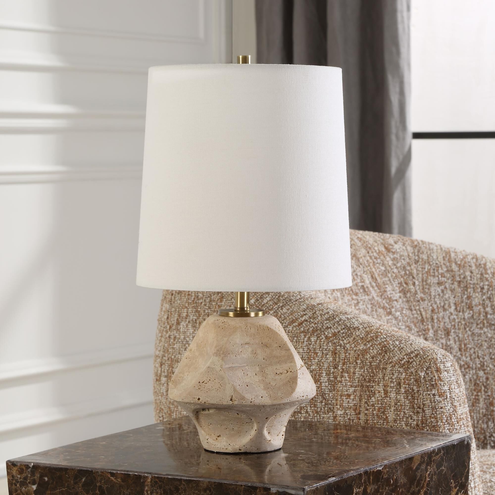 Shown in This Accent Lamp Features A Scooped Out Travertine Base Paired With Plated Antique Brass Accents. finish and Round Hardback shade