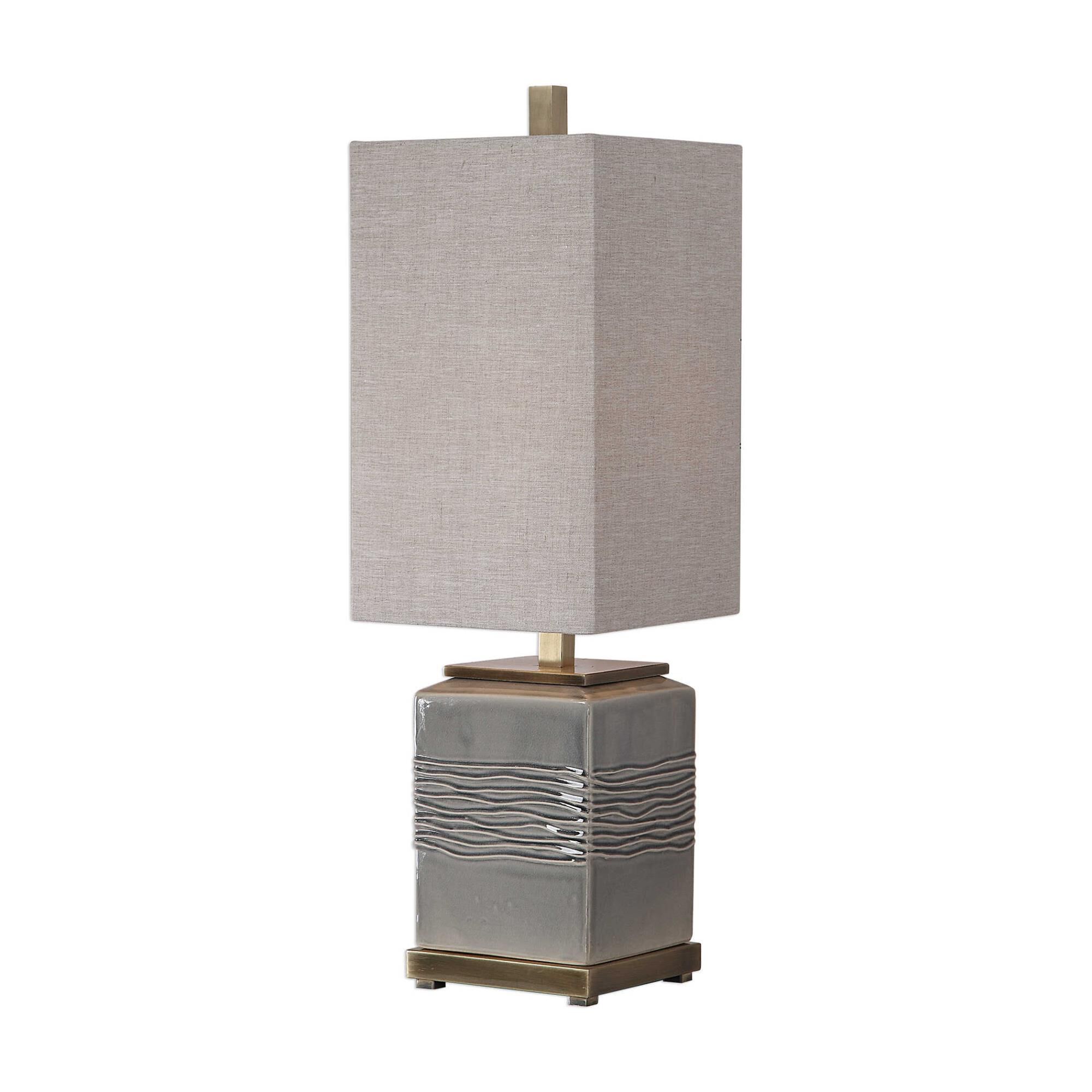 Shown in A Contemporary Style Emanates From This Ceramic Base That Features Wavy Embossing That Has A Subtle  finish and Rectangle Hardback Fabric shade