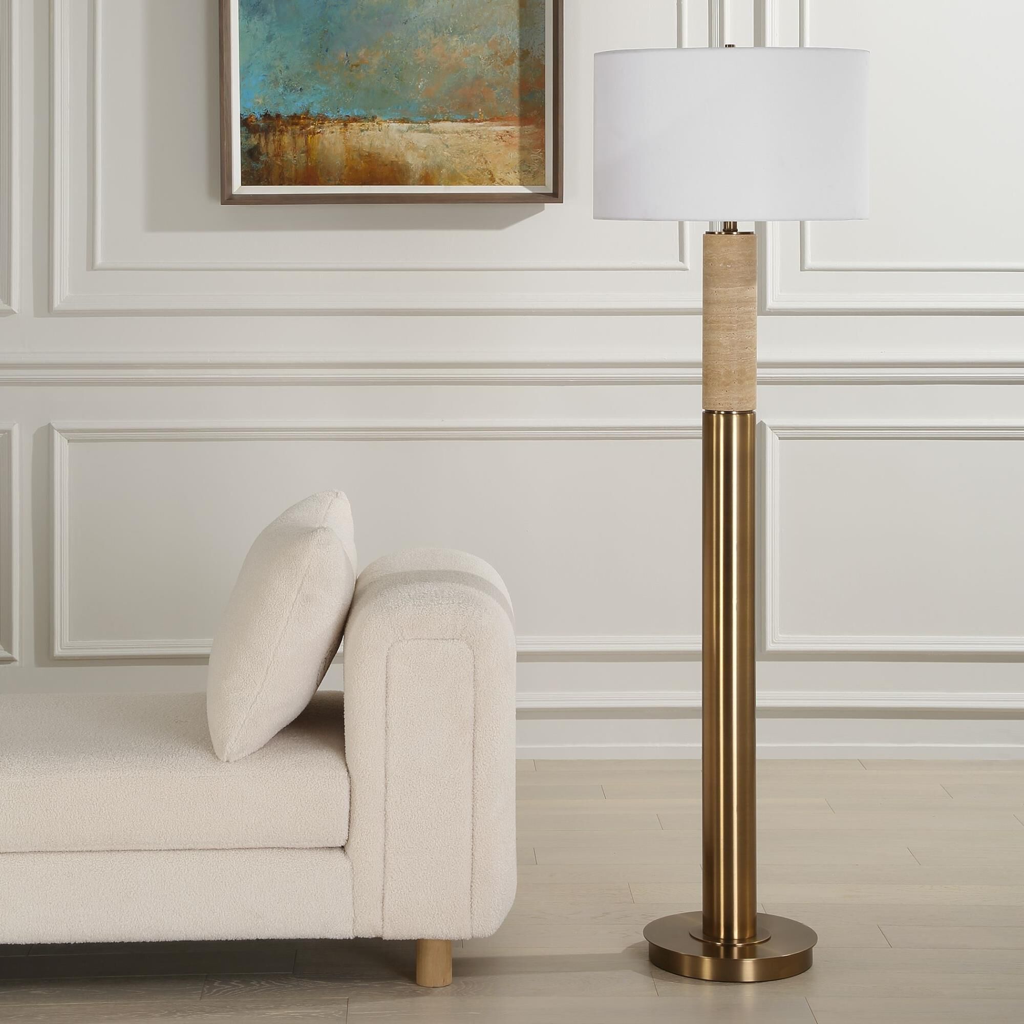 Shown in The Knox Floor Lamp Showcases A Solid Travertine Column Displayed On A Matching Antique Brass Plated finish and Round Hardback shade