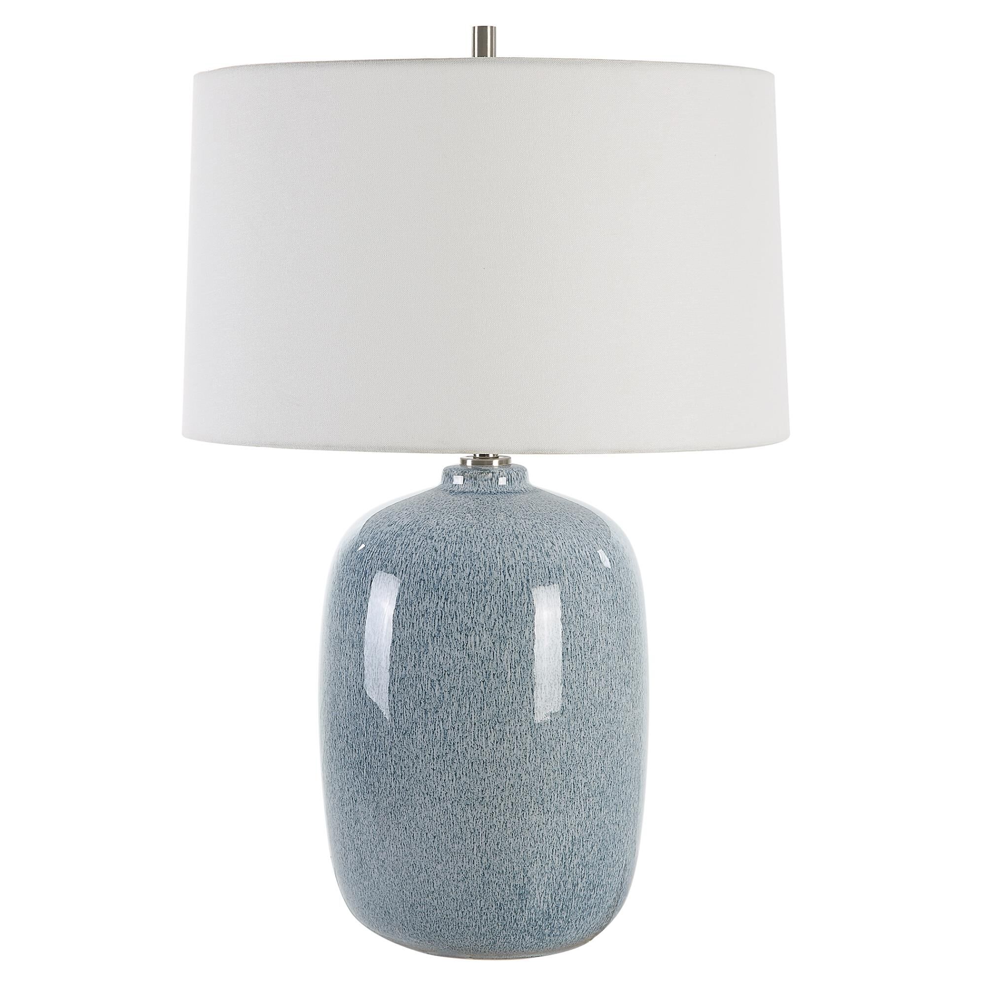 Shown in This Ceramic Table Lamp Features A Peaceful Sky Blue Glaze With Cobalt Mottled Details Paired With P finish and Round Hardback shade