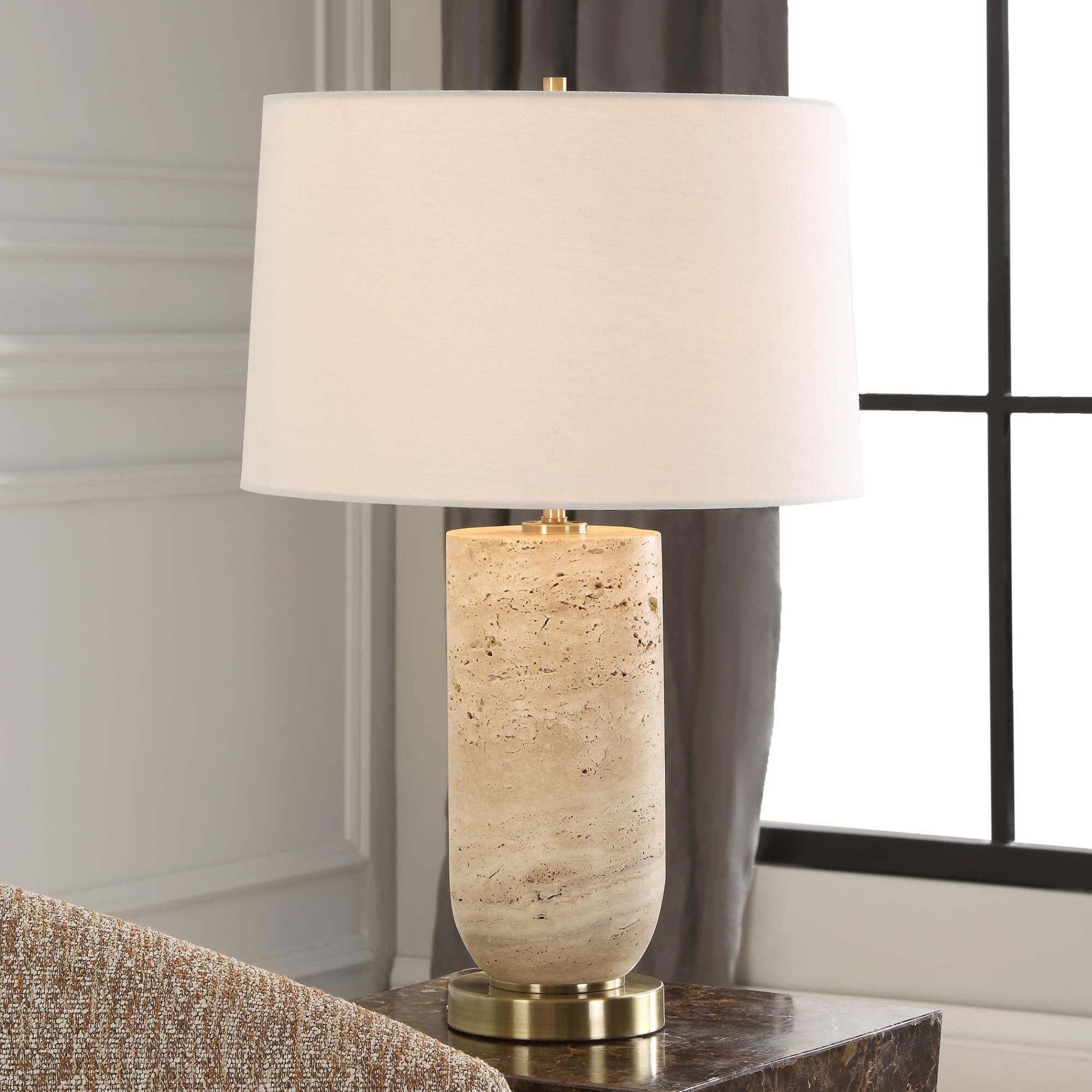 Shown in The Aubrey Table Lamp Harmonizes Natural Beauty With Classic Elegance. Crafted From Travertine, Its  finish and Round Hardback shade