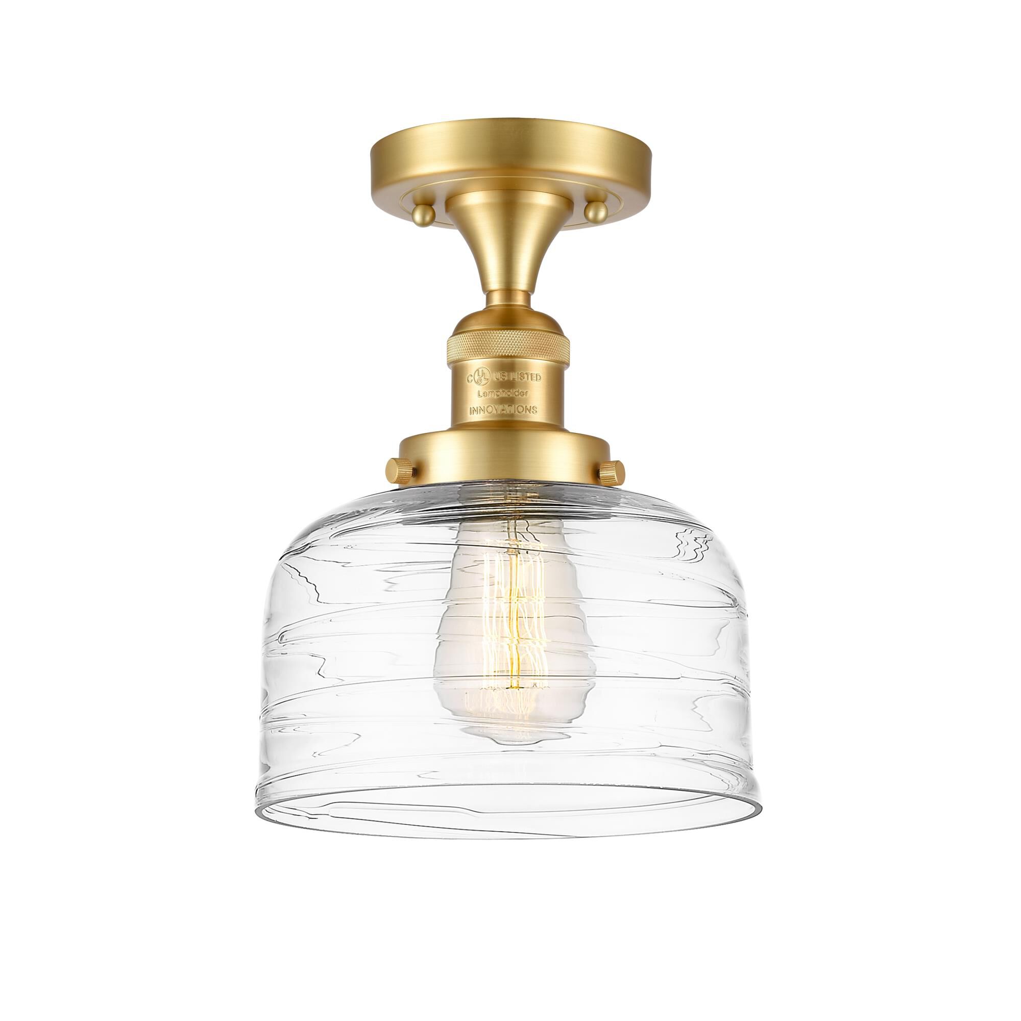 Shown in Satin Gold finish and Clear Deco Swirl Large Bell glass