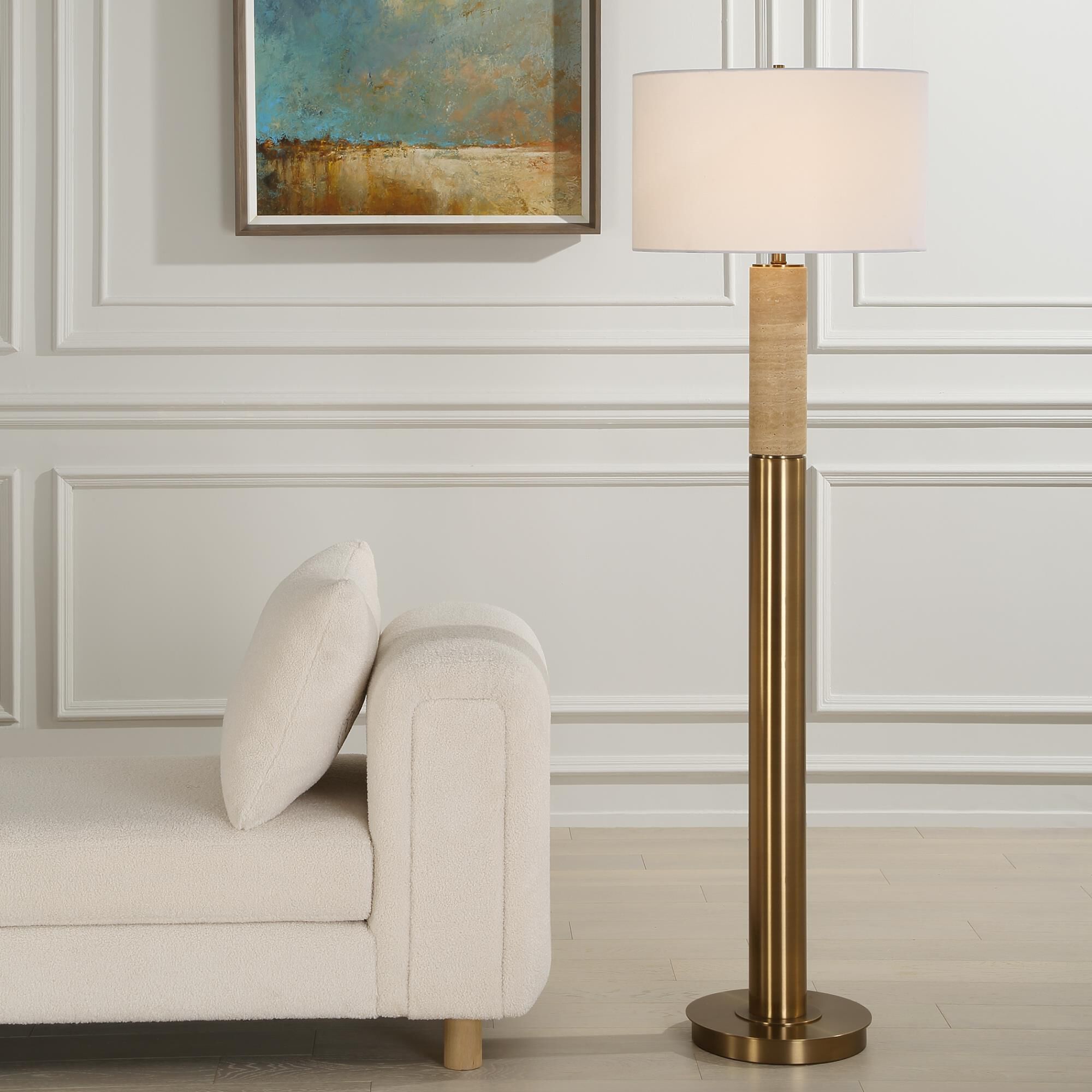 Shown in The Knox Floor Lamp Showcases A Solid Travertine Column Displayed On A Matching Antique Brass Plated finish and Round Hardback shade