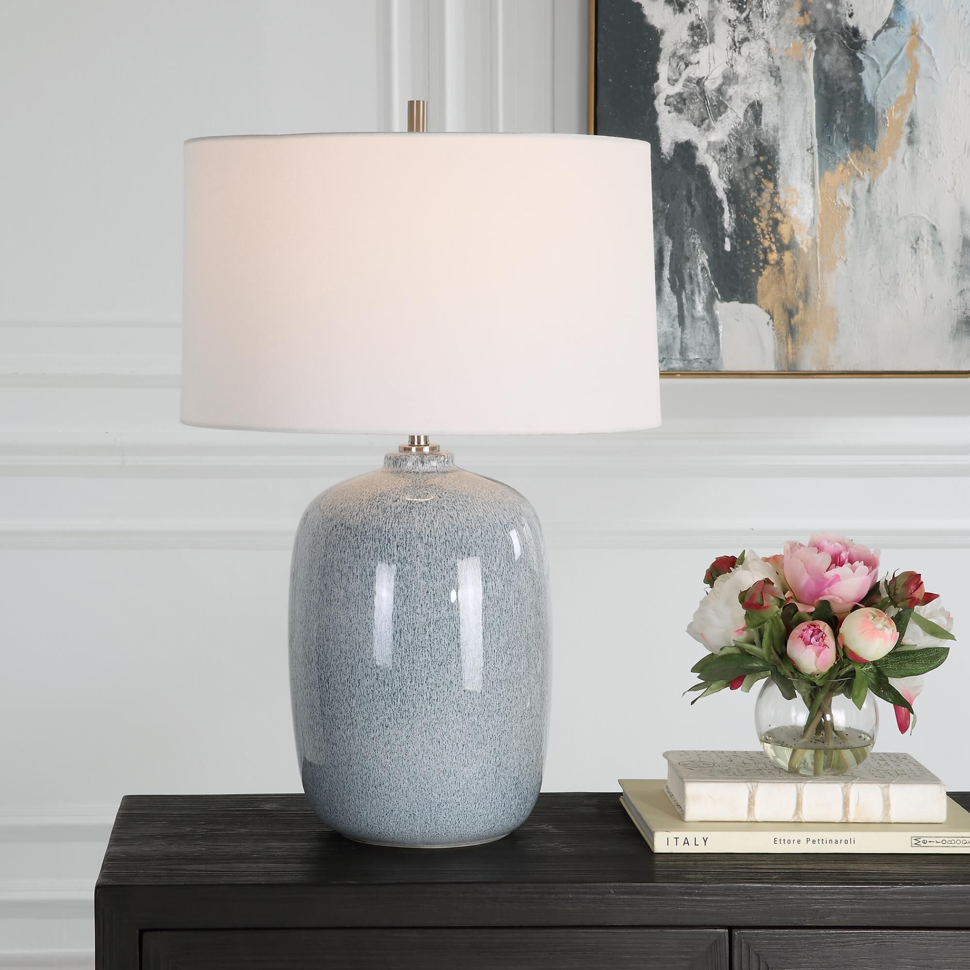 Shown in This Ceramic Table Lamp Features A Peaceful Sky Blue Glaze With Cobalt Mottled Details Paired With P finish and Round Hardback shade