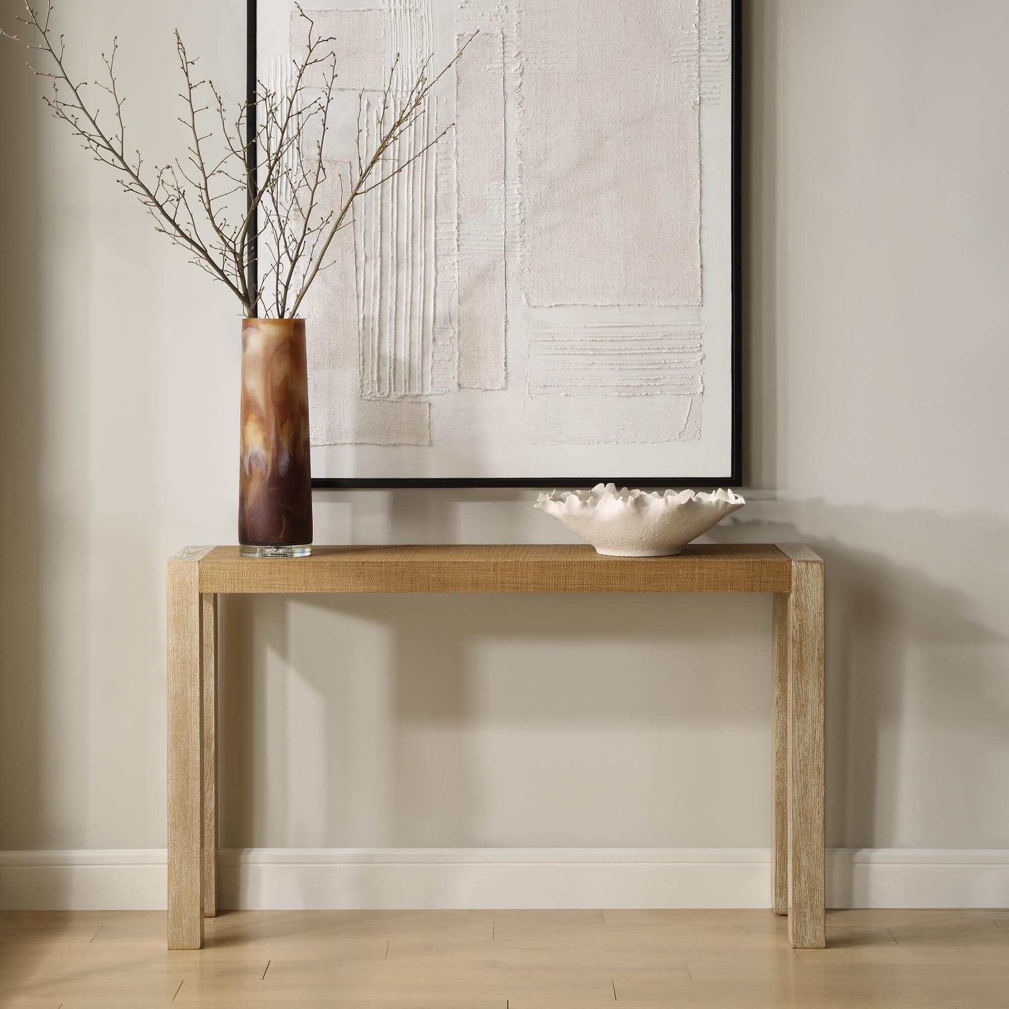 Shown in Organic And Breathtaking, The Bentley Console Table Is Composed Of A Textured Grasscloth Top And Com finish