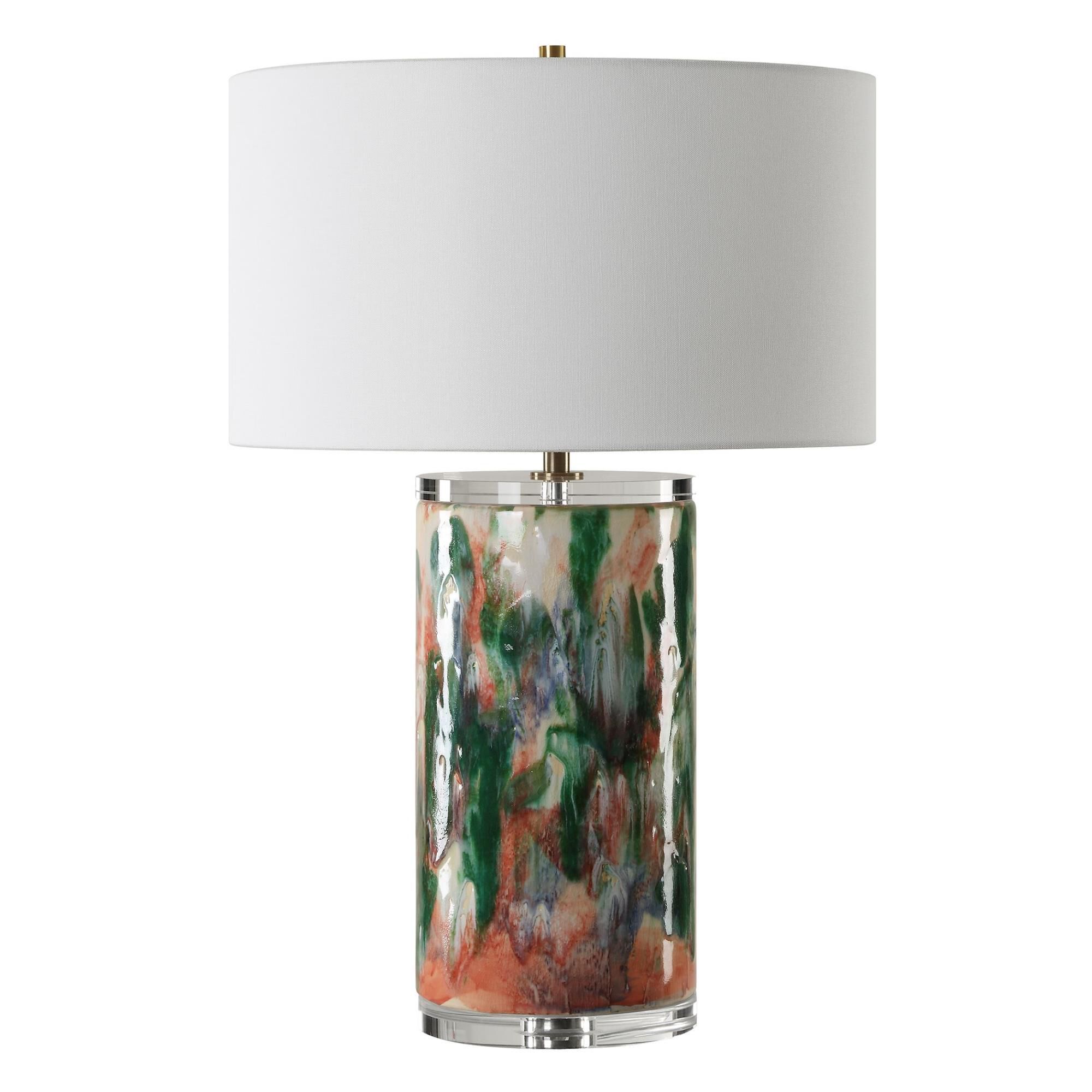 Shown in This Unique Ceramic Lamp Is Finished Like An Abstract Piece Of Art Featuring Shades Of Luscious Gree finish and Round Drum Hardback shade