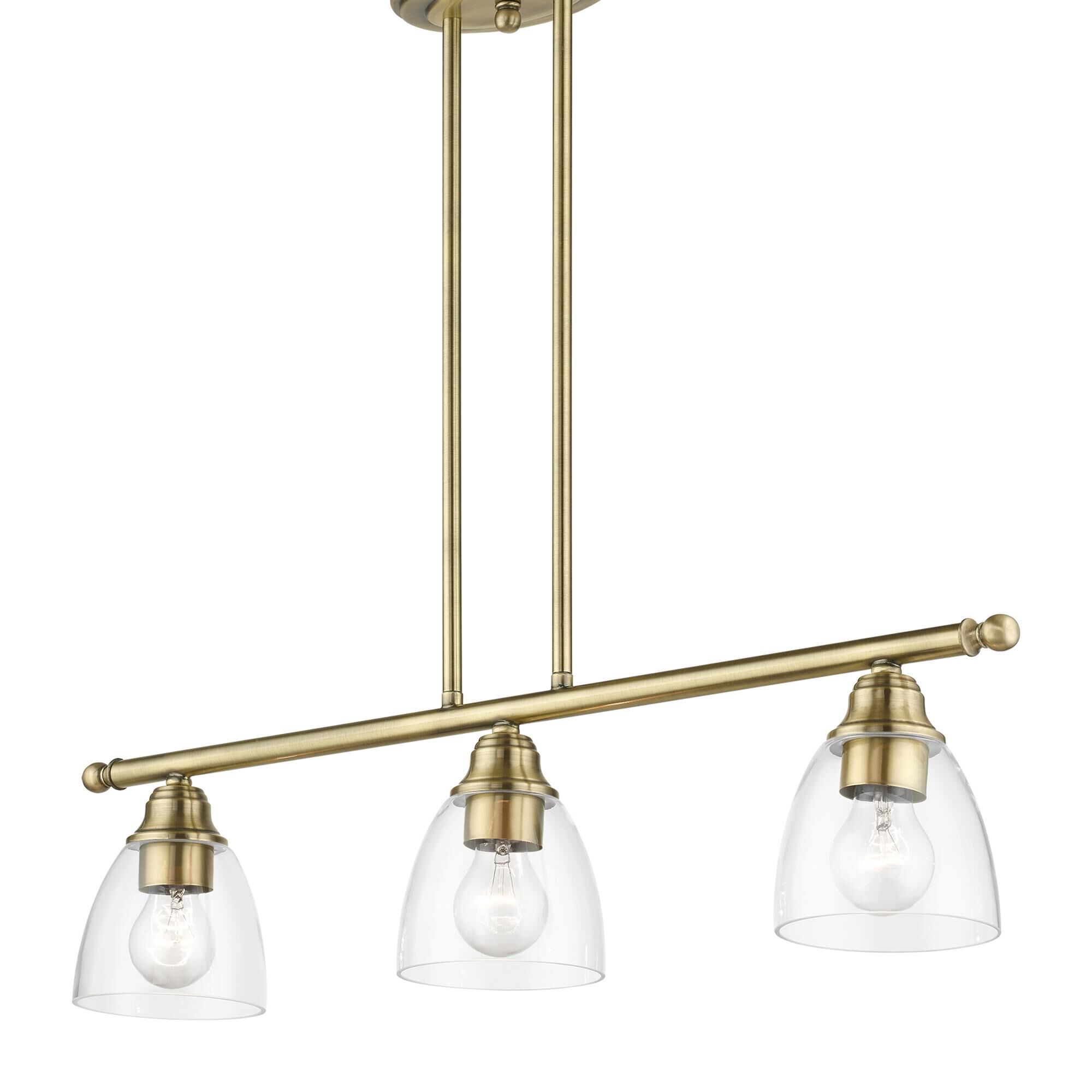 Shown in Antique Brass finish and Hand Blown Clear glass