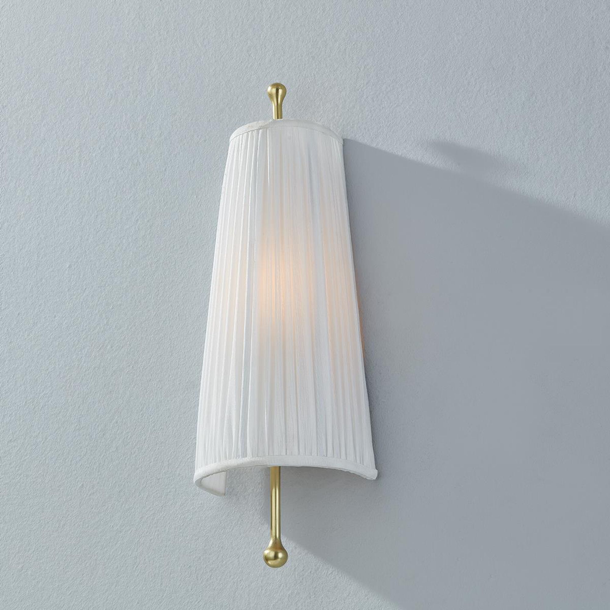 Shown in Aged Brass finish and Faux White Silk shade