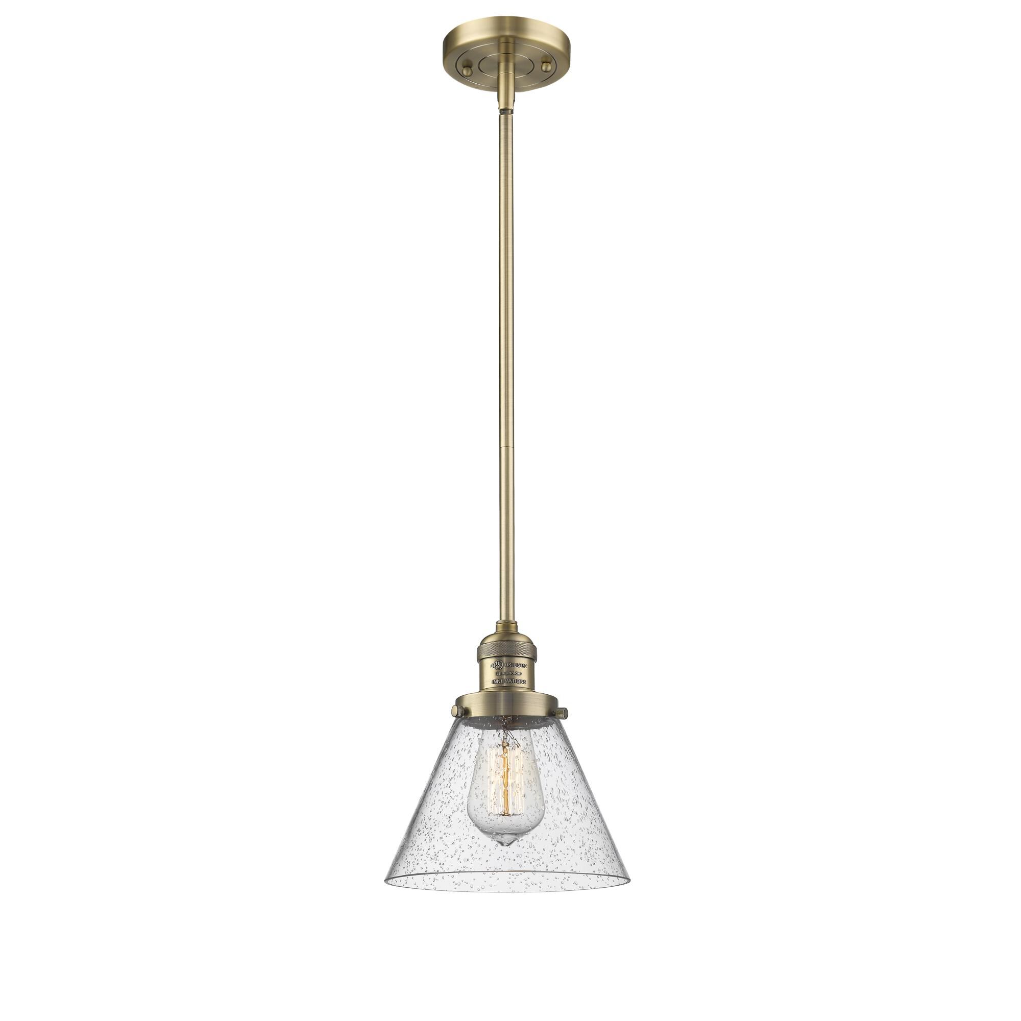 Shown in Brushed Brass finish and Seedy glass