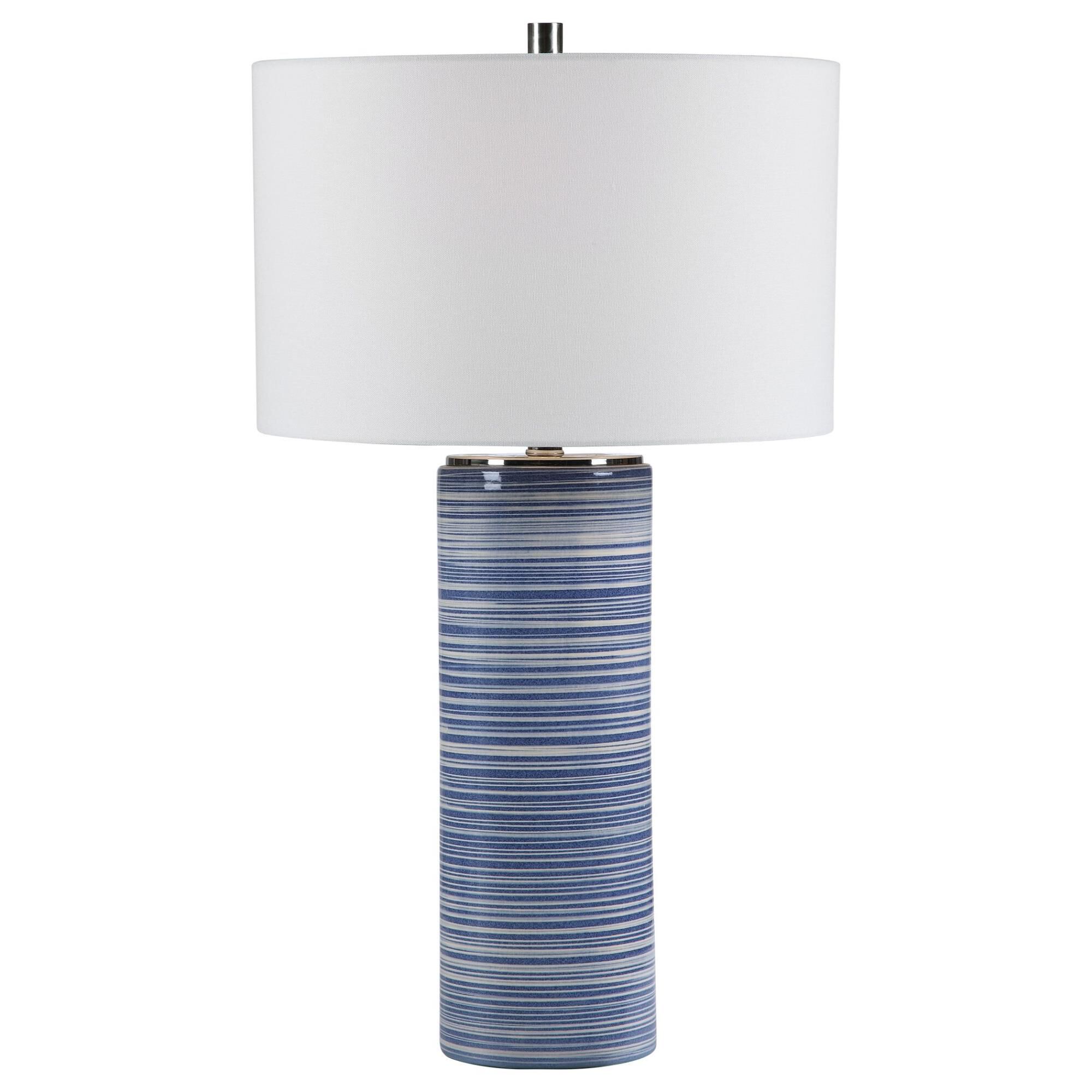 Shown in Showcasing Trendy White And Indigo Hues, This Ceramic Table Lamp Has A Striped Glaze With Polished N finish and Round Drum Hardback shade