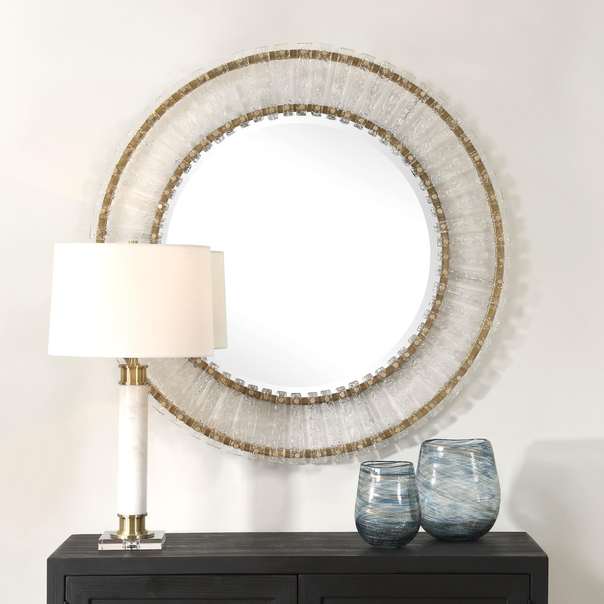 Shown in The Denali Round Mirror Features Textured Glass Keys Suspended Around Brushed Gold  Iron Frames. Mir finish