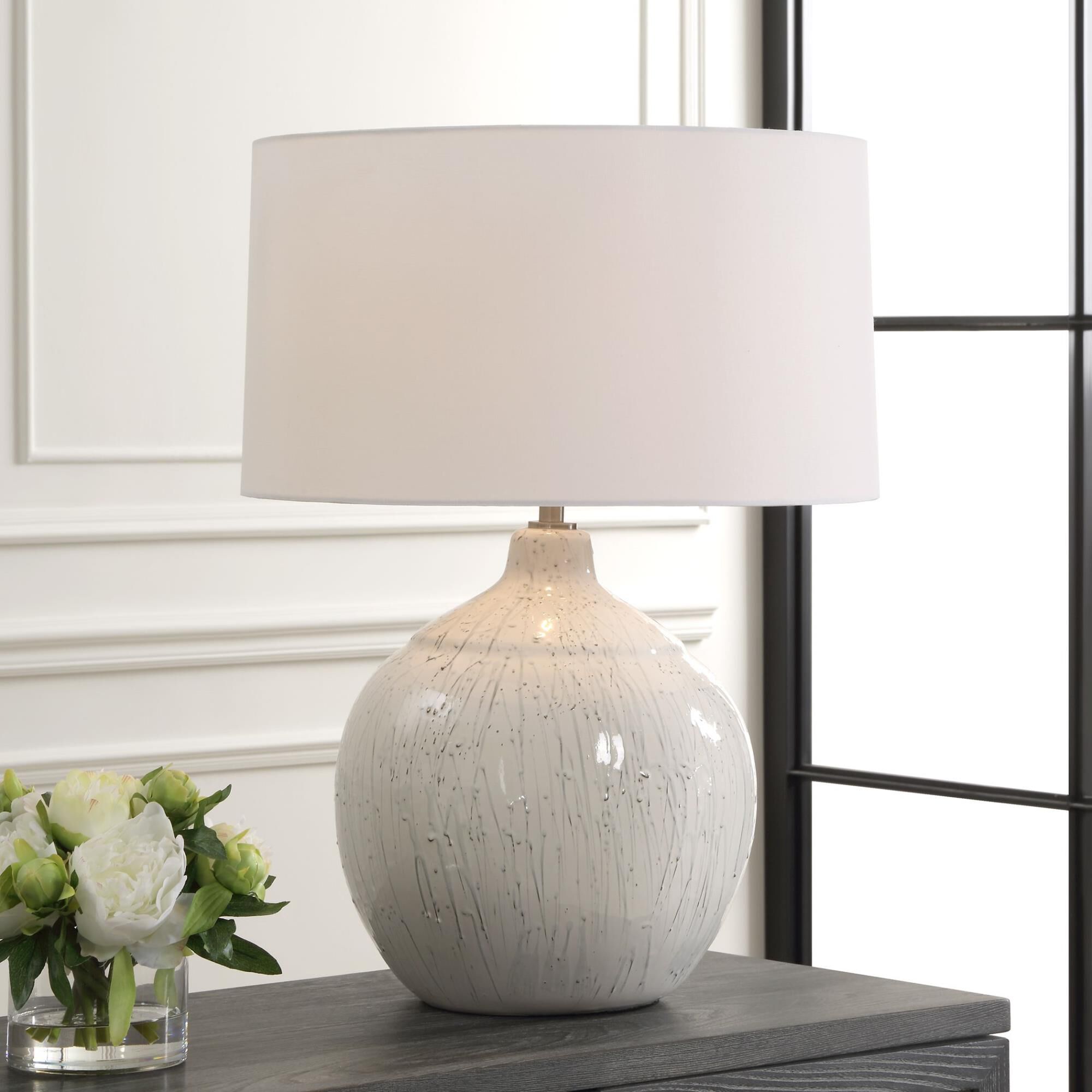 Shown in This Ceramic Table Lamp Features A White Glaze Finish With A Dripped Gray Texture, Paired With Plate finish and Round Hardback shade