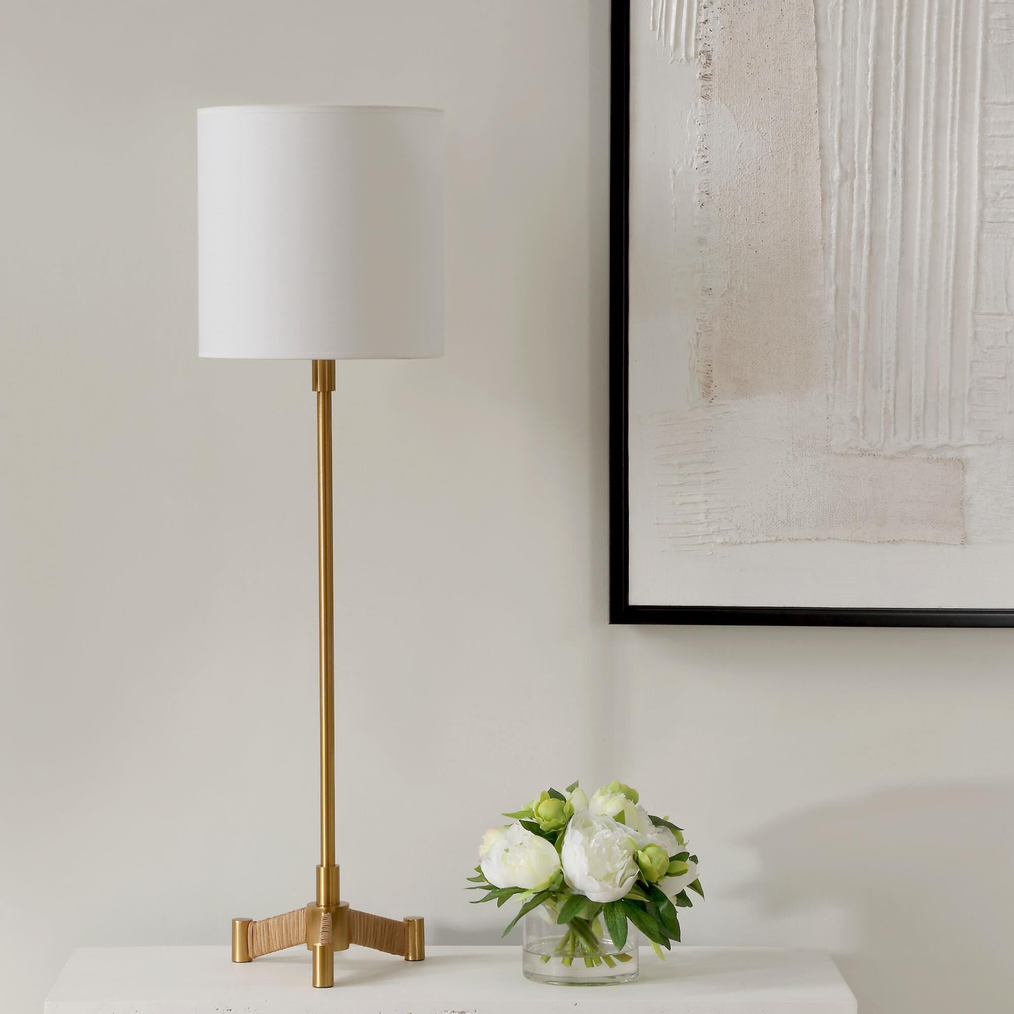 Shown in This Versatile Buffet Lamp Showcases A Plated Brass Slim Metal Base Accented By Rattan Wrapped Legs. finish and Round Hardback shade