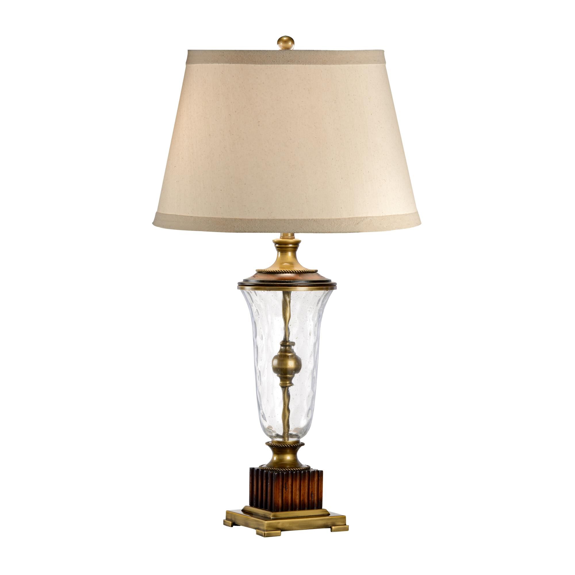 Shown in Wood And Solid Antique Brass finish and Mouth Blown crystal and Linen shade