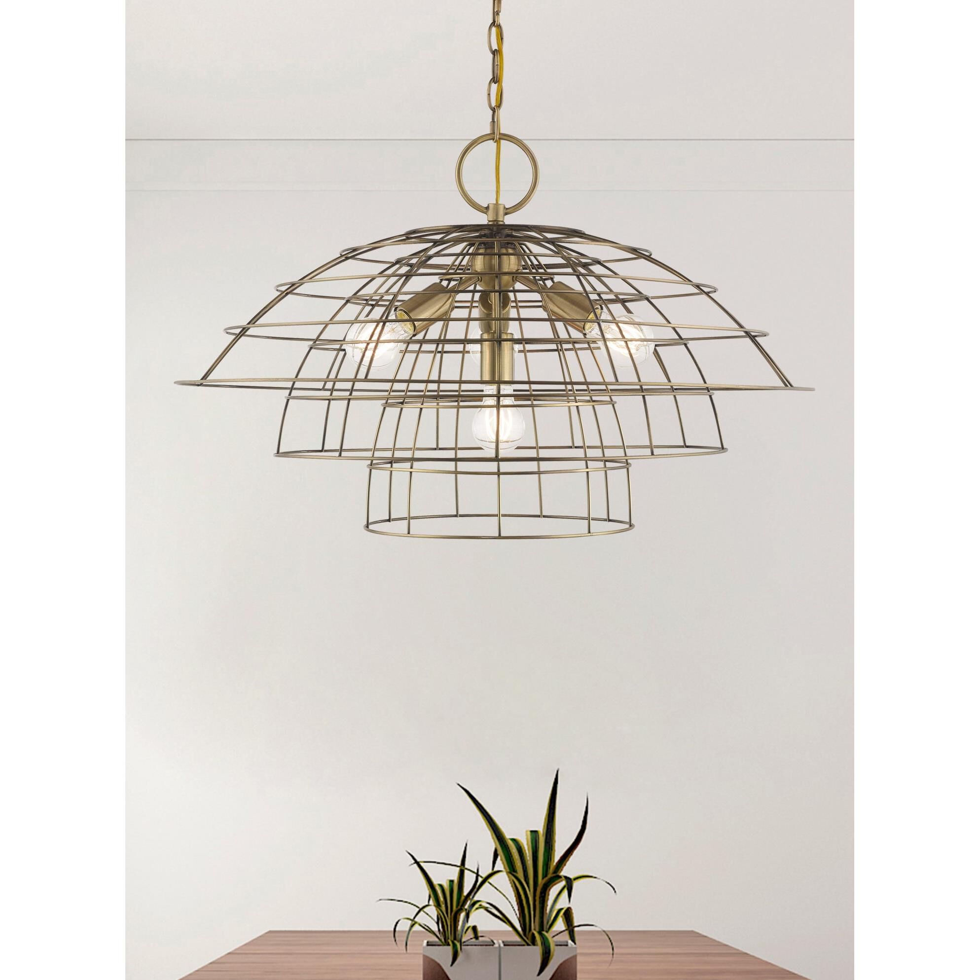 Shown in Antique Brass finish and Antique Brass Hand Crafted Steel Wire Cage shade