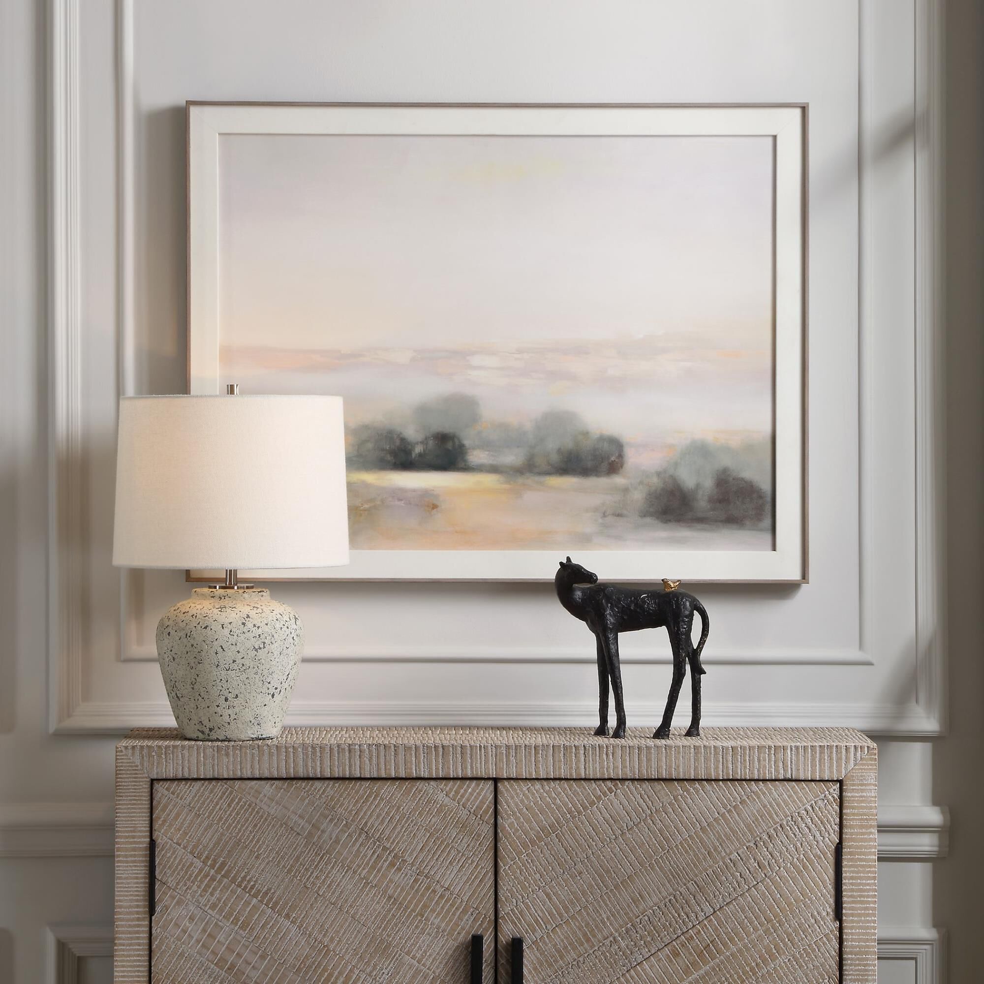 Shown in The Rupture Table Lamp Features A Heavily Distressed Aged Ivory Finish With Stone Gray Undertones An finish and Round Hardback shade