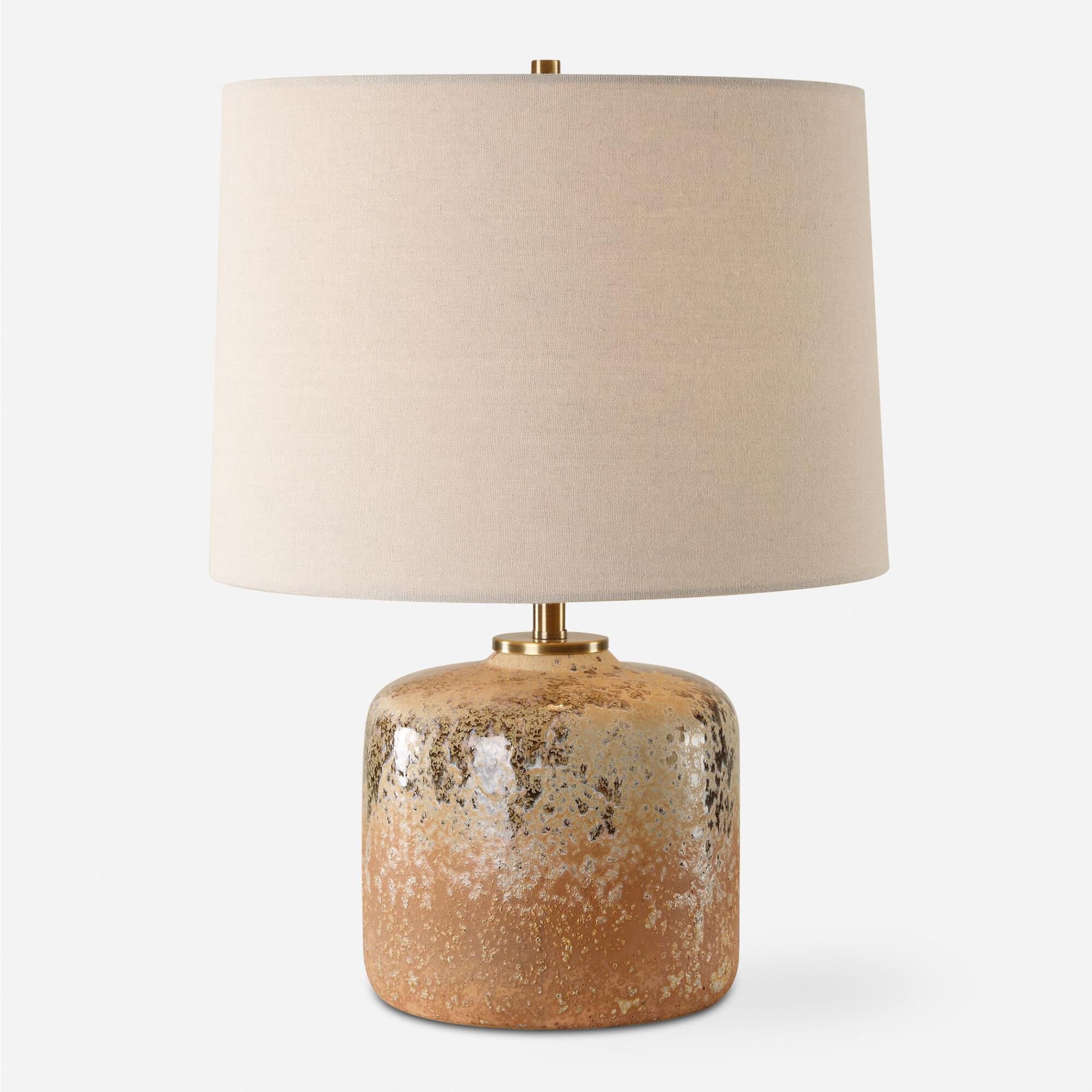 Shown in Bringing The Rustic Charm Of The West Indoors, The Canyon Table Lamp Features A Chocolate And Tan Mo finish and Round Hardback shade