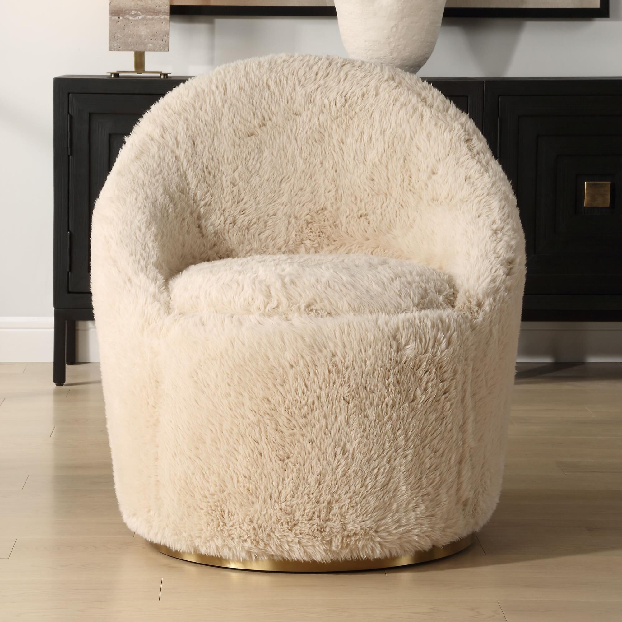 Shown in A Blend Of Contemporary And Cozy, This Chair Is Upholstered In A Caramel Toned Long-Haired Faux Shee finish