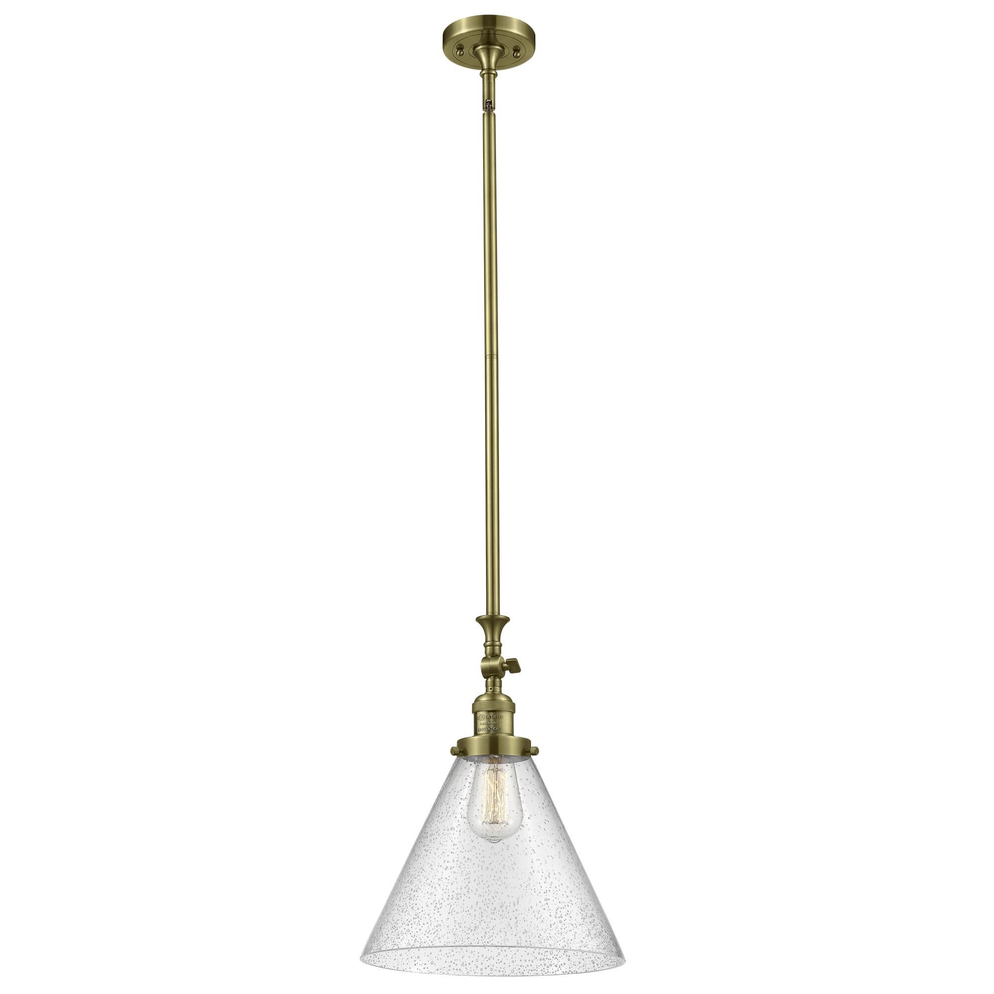 Shown in Antique Brass finish and Seedy glass