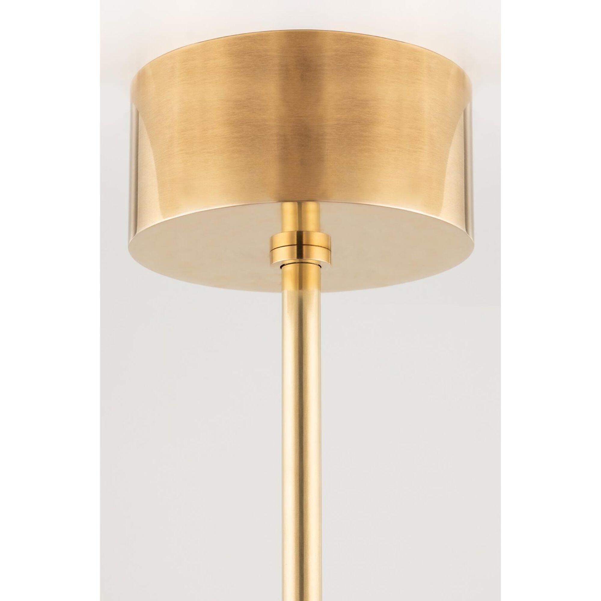 Shown in Aged Brass finish and Matte White Glass And Metal shade