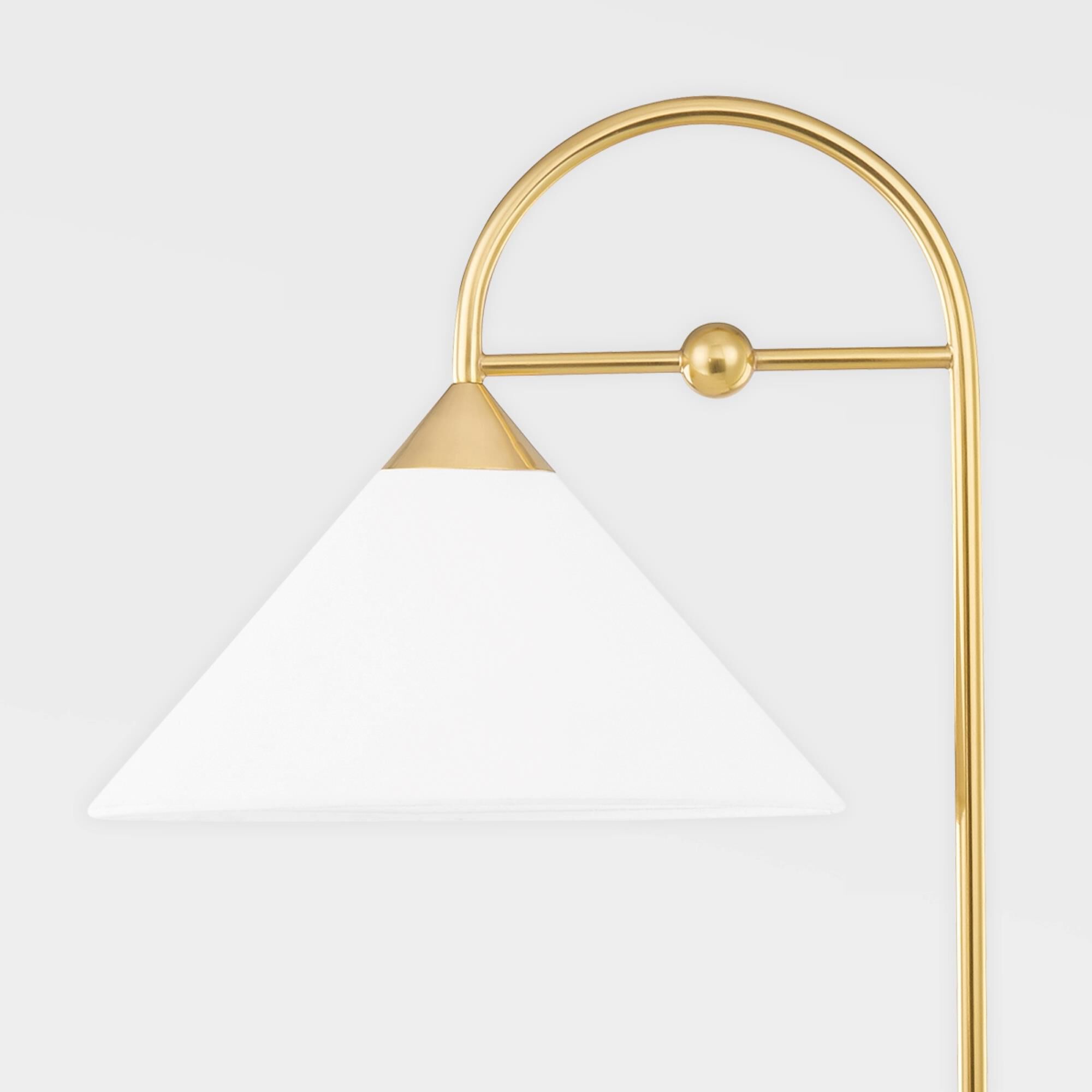 Shown in Aged Brass finish and White Linen shade