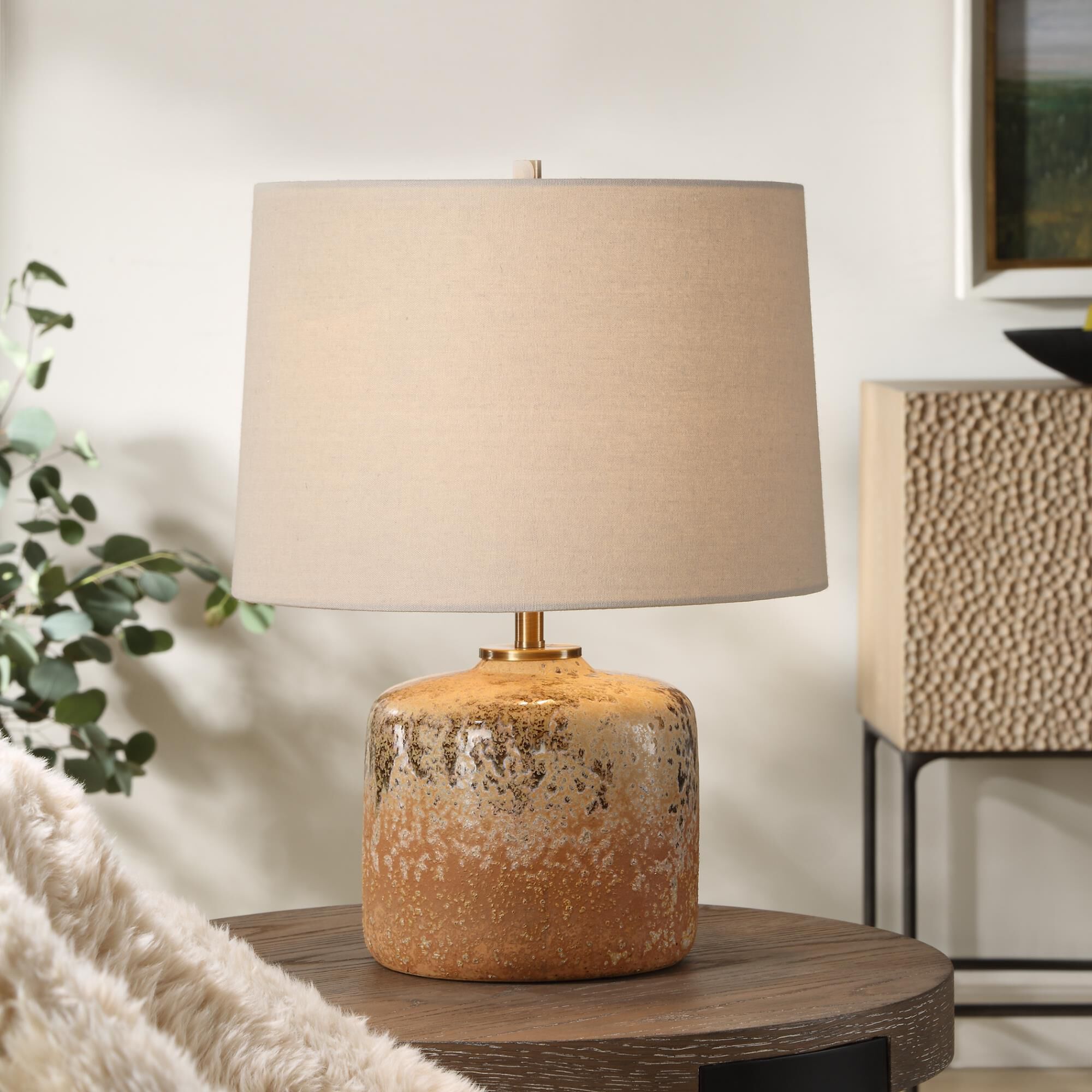 Shown in Bringing The Rustic Charm Of The West Indoors, The Canyon Table Lamp Features A Chocolate And Tan Mo finish and Round Hardback shade