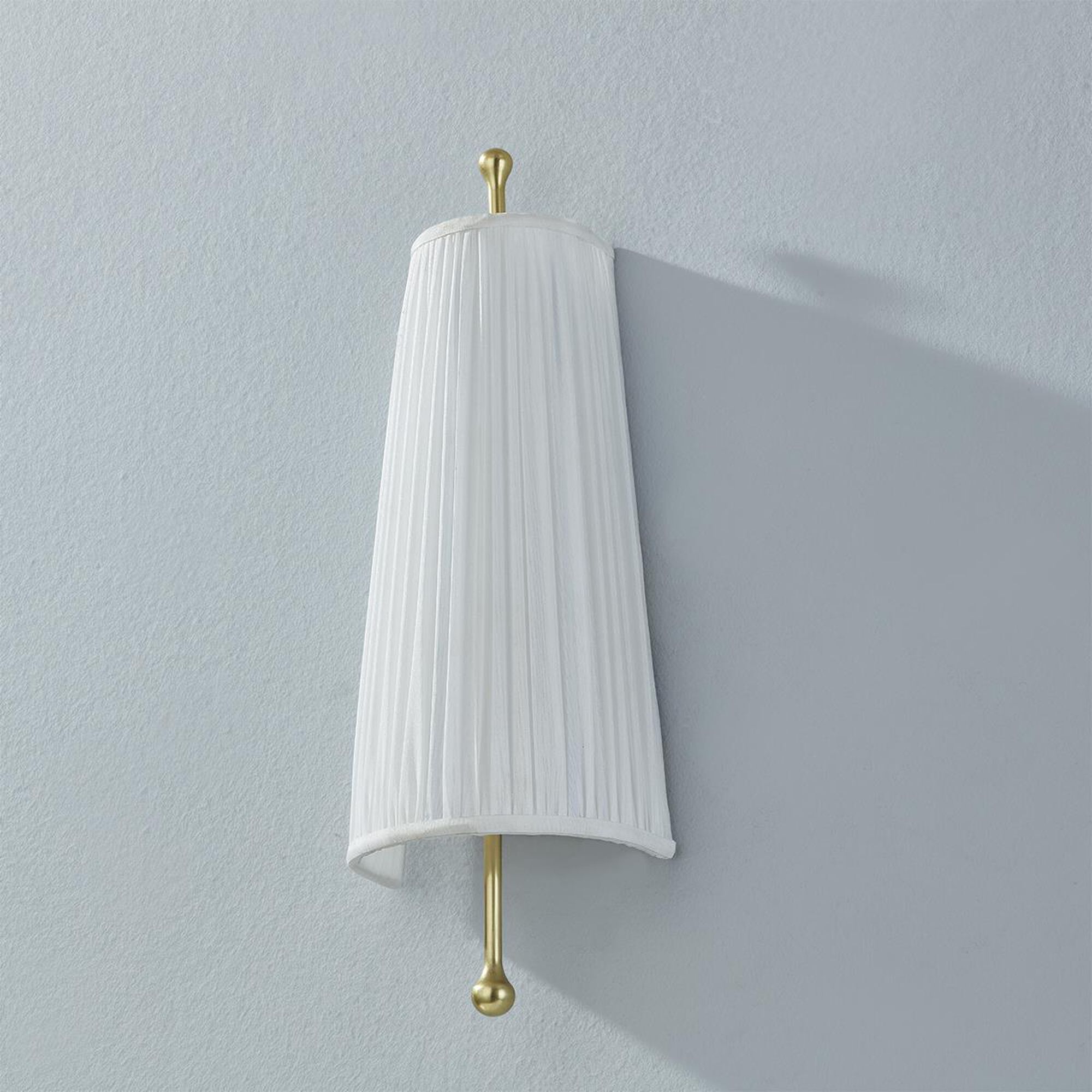 Shown in Aged Brass finish and Faux White Silk shade