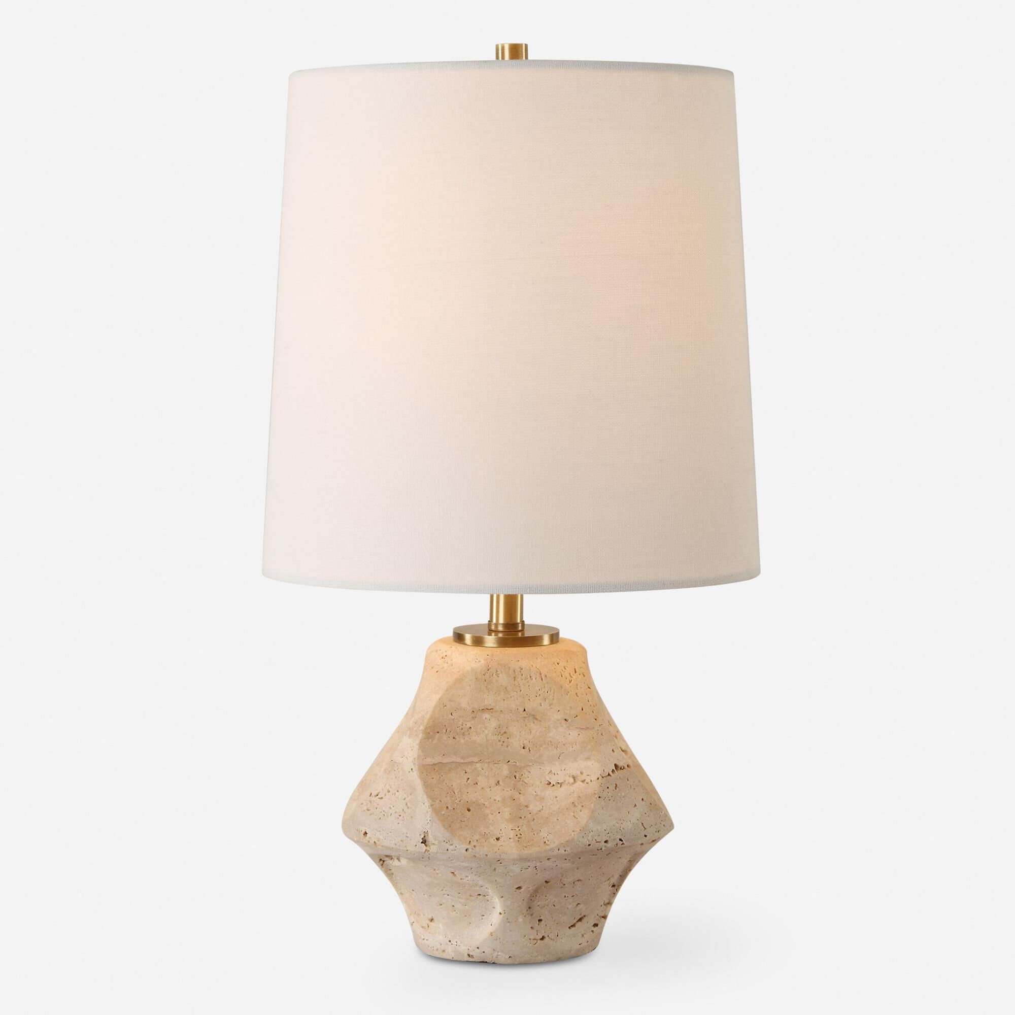 Shown in This Accent Lamp Features A Scooped Out Travertine Base Paired With Plated Antique Brass Accents. finish and Round Hardback shade