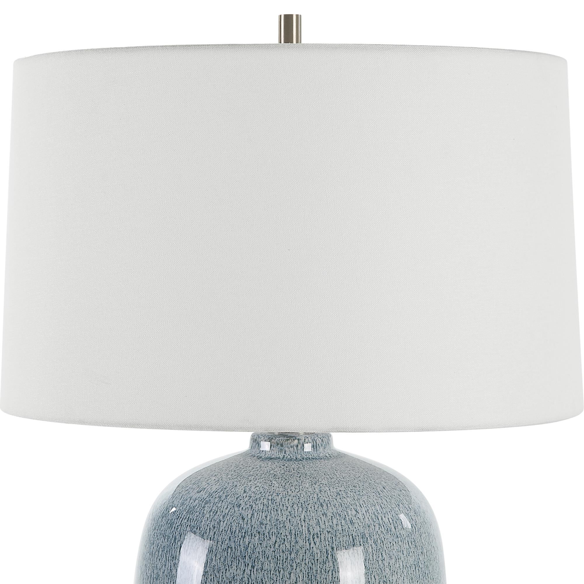 Shown in This Ceramic Table Lamp Features A Peaceful Sky Blue Glaze With Cobalt Mottled Details Paired With P finish and Round Hardback shade