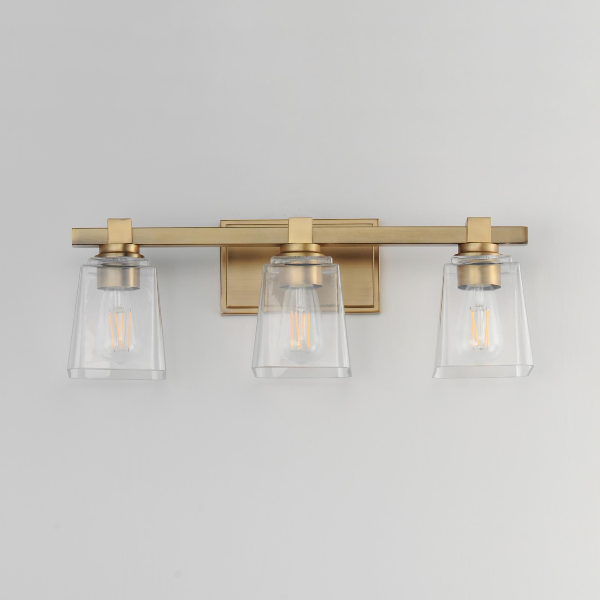 Shown in Natural Aged Brass finish and Clear glass and Glass shade