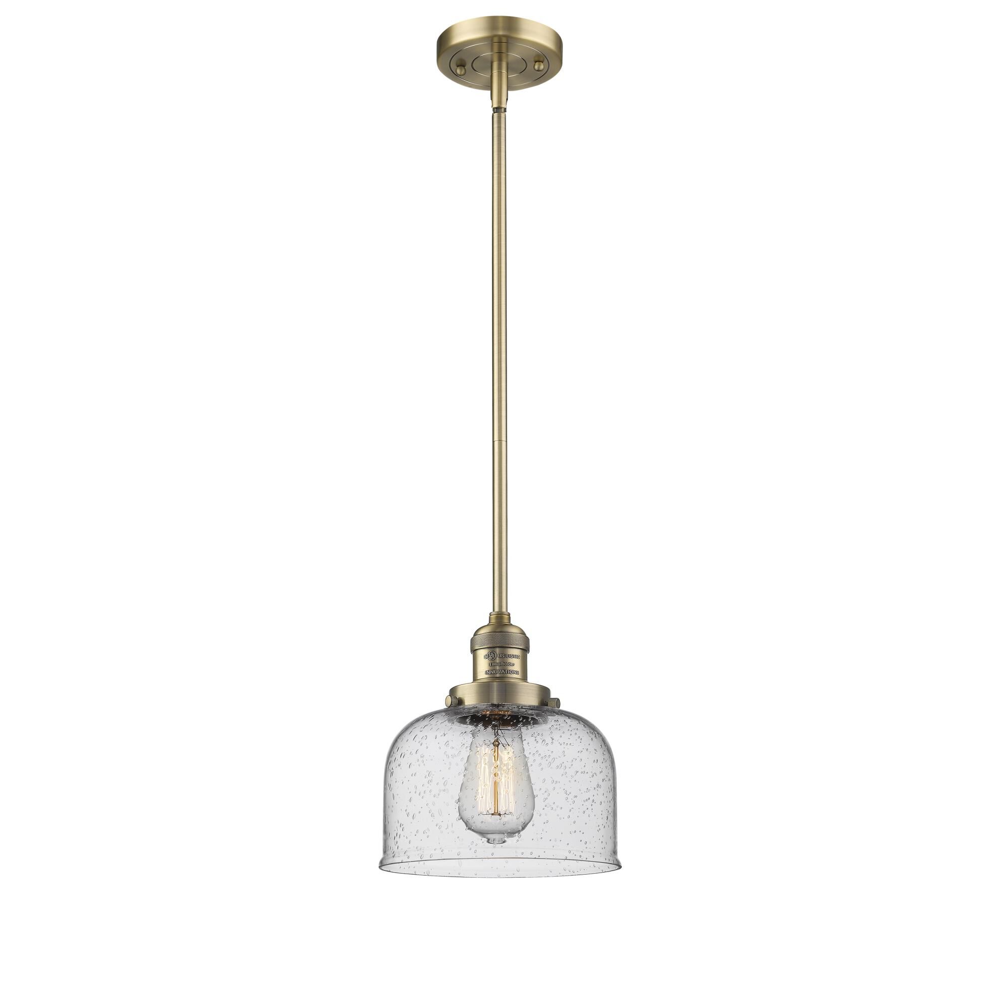 Shown in Brushed Brass finish and Seedy glass