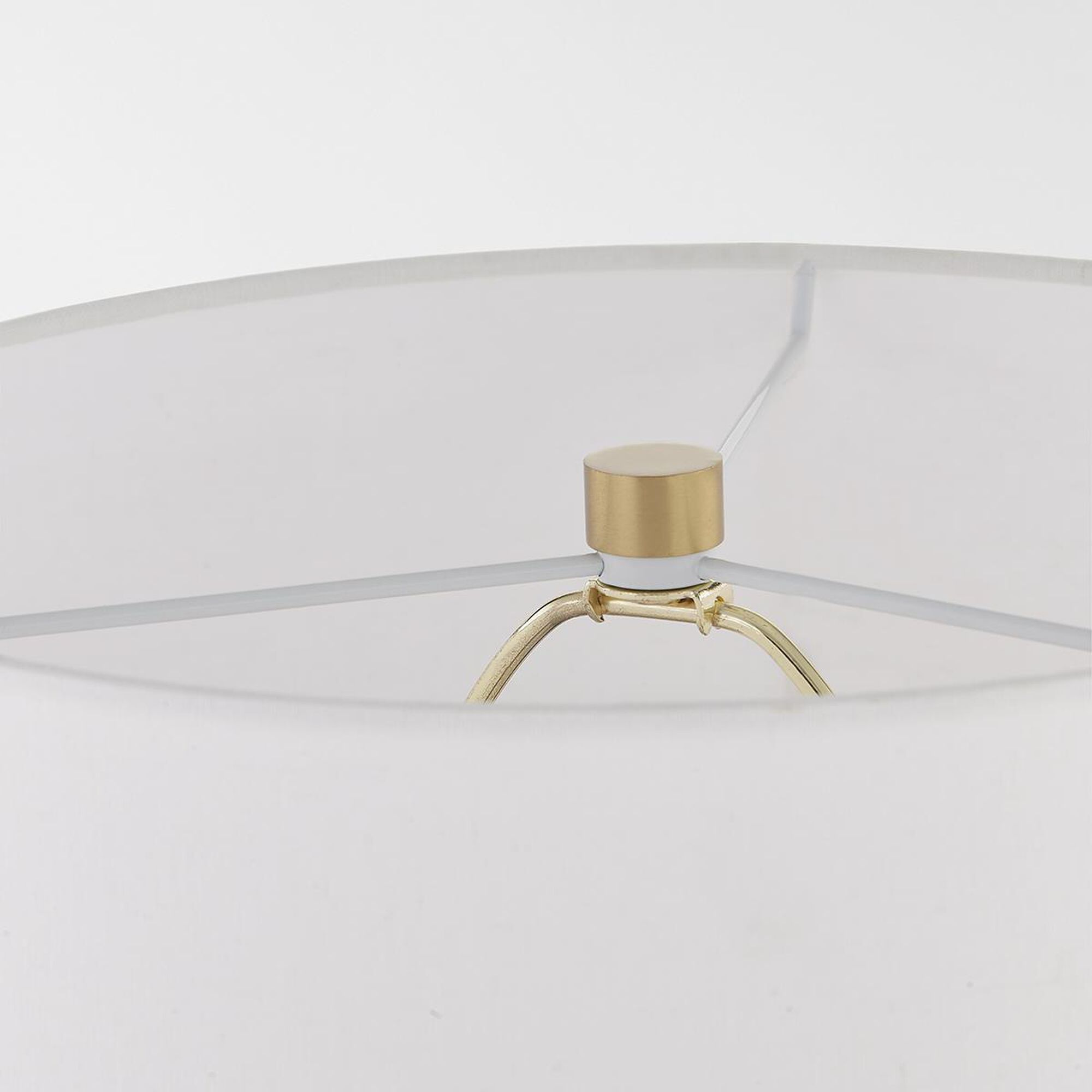 Shown in Aged Brass finish and Off White Linen shade