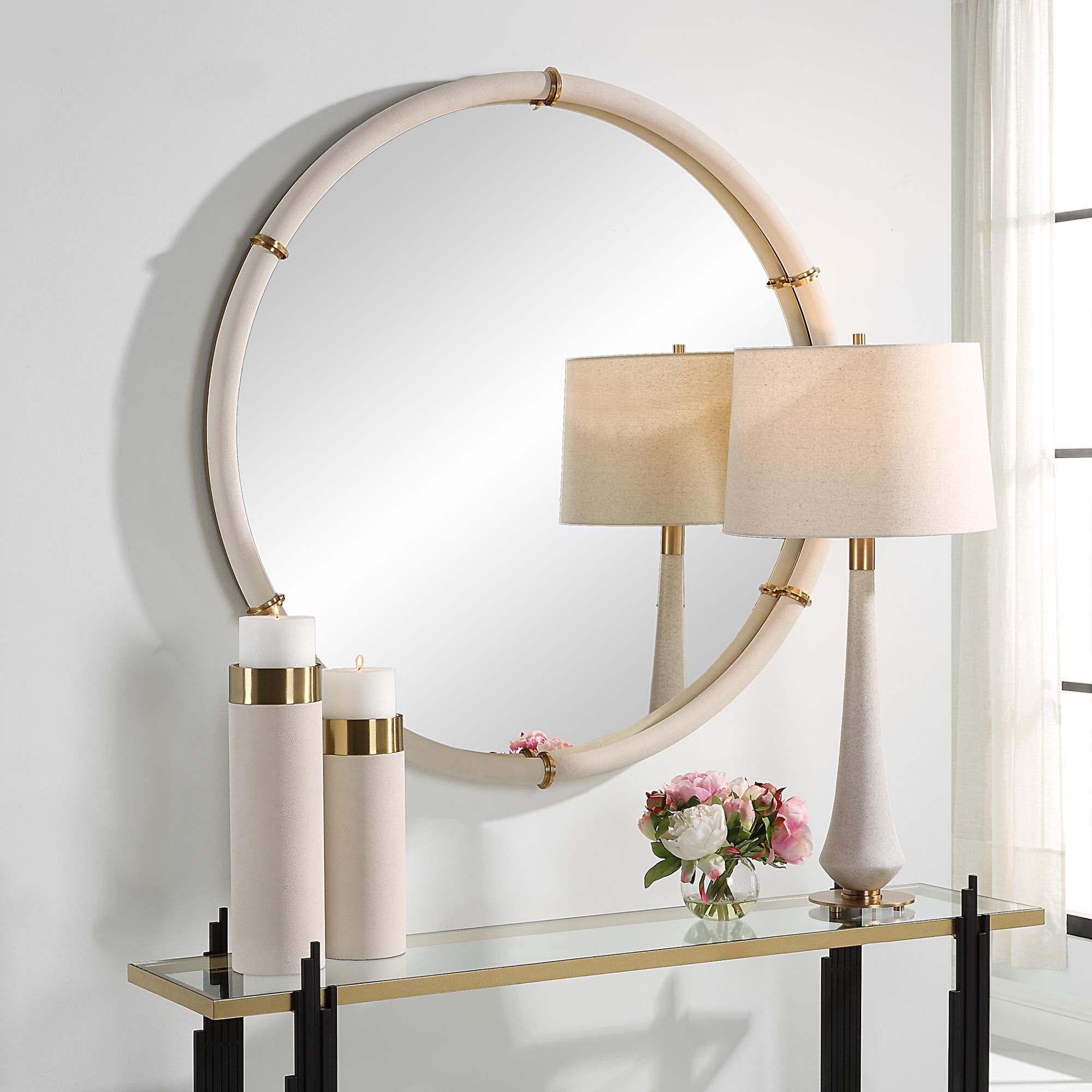 Shown in The Cyprus Round Mirror Showcases A White Faux Shagreen Leather Wrap Featuring Brass Plated Steel Ba finish