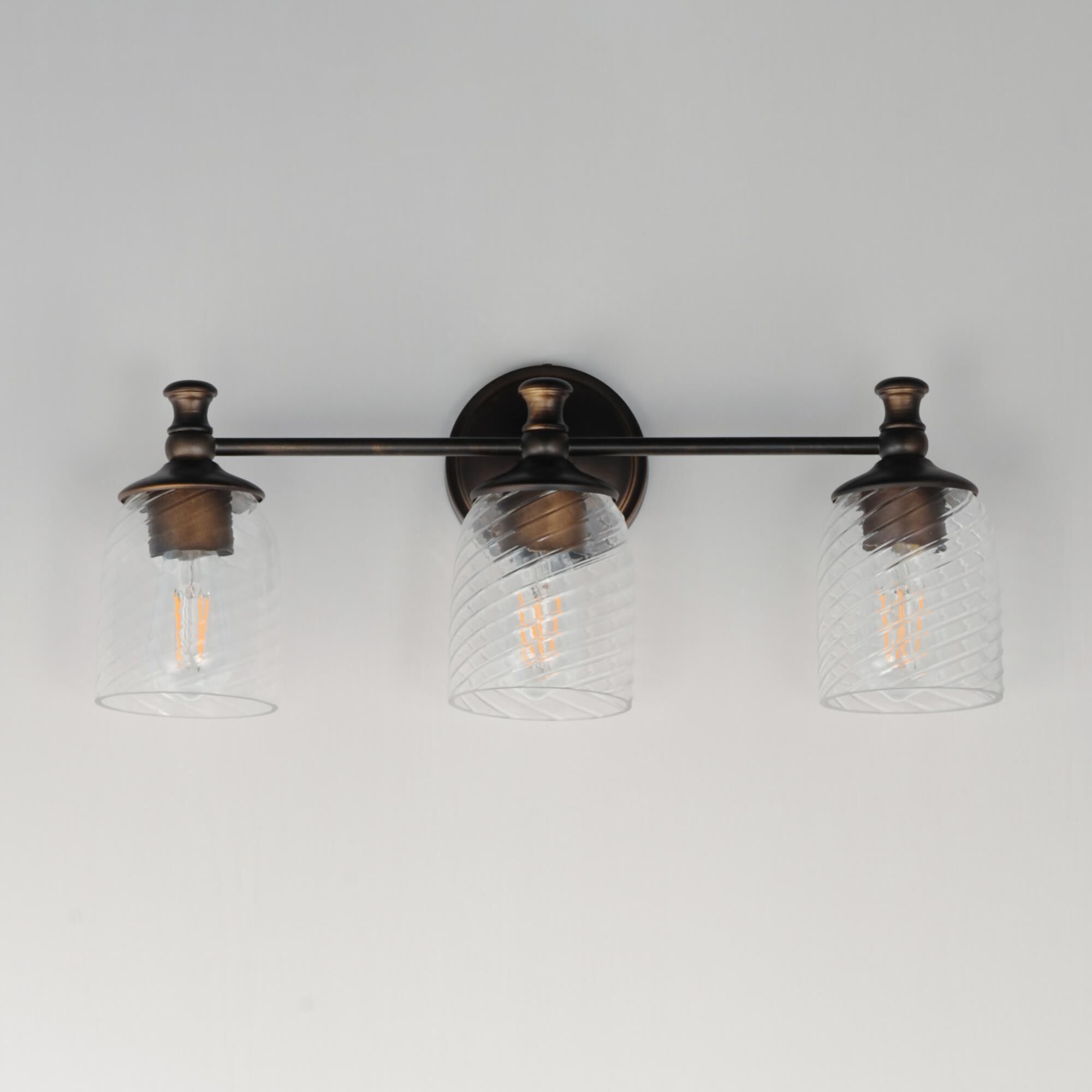 Shown in Antique Bronze finish and Clear Ribbed glass and Glass shade