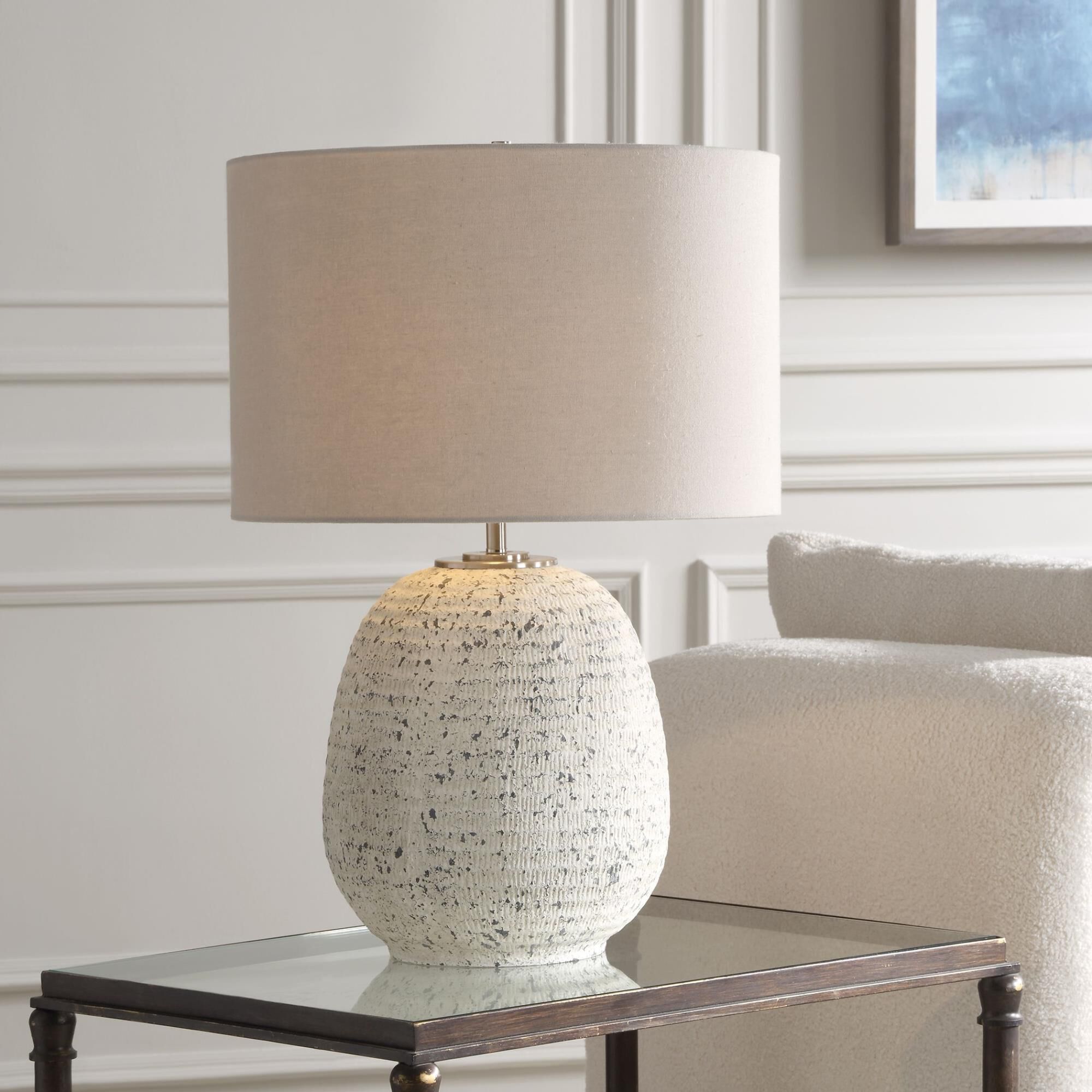 Shown in This Ceramic Table Lamp Boast A Ribbed Textured Surface Finished In A Heavily Distressed Stone Ivory finish and Round Drum Hardback shade