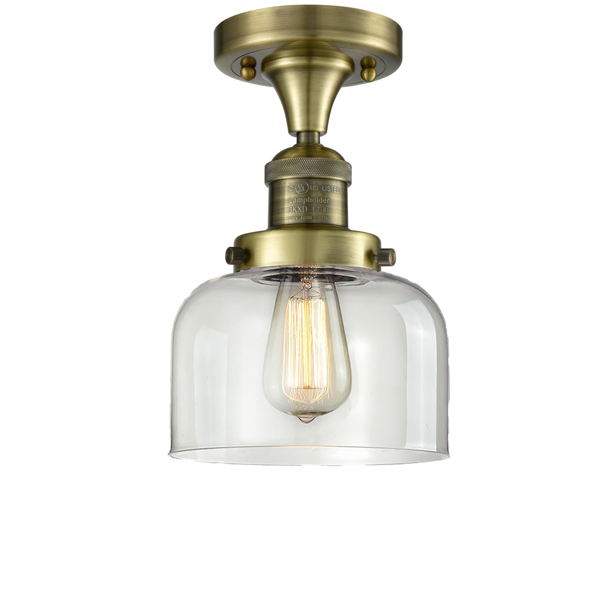 Shown in Antique Brass finish and Clear glass