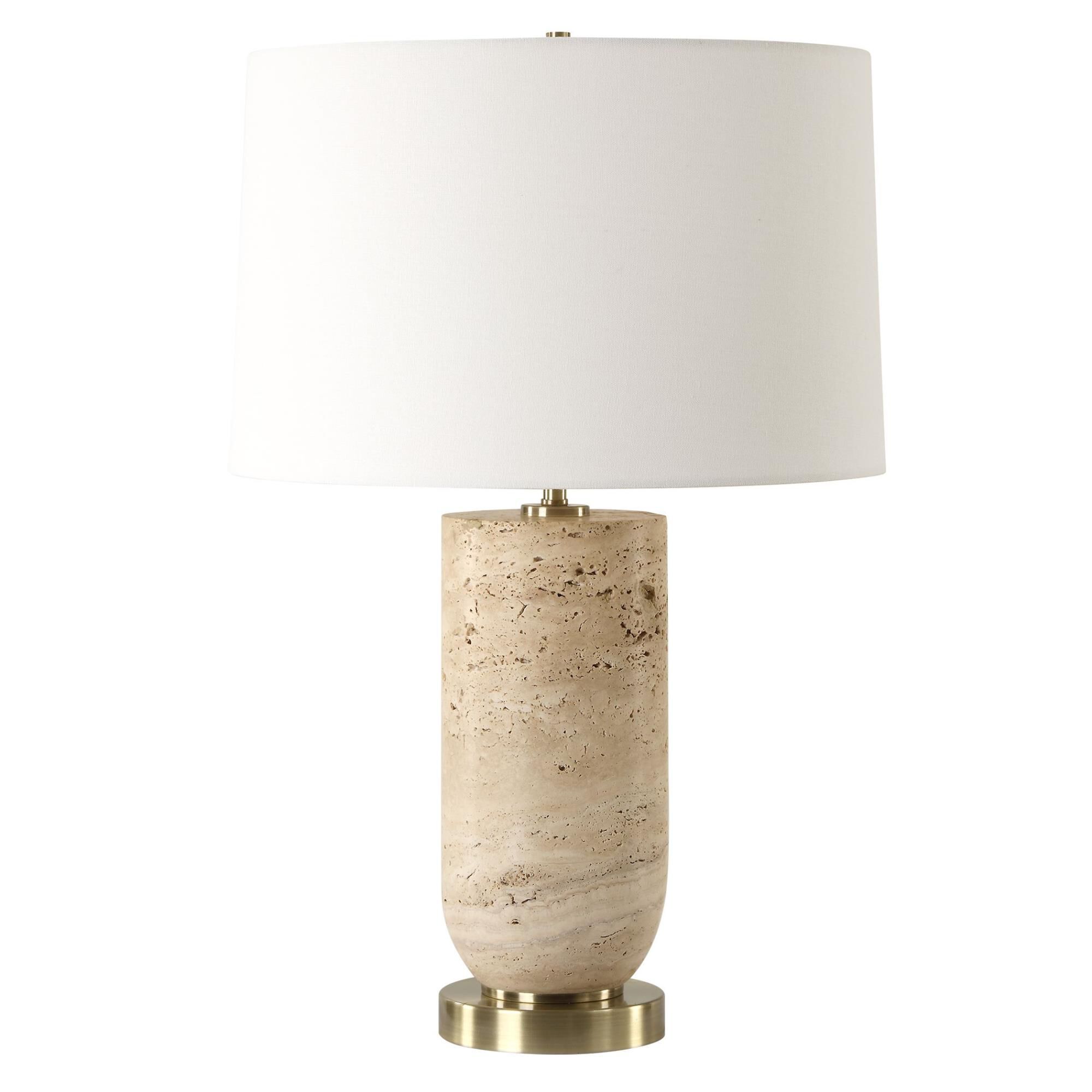 Shown in The Aubrey Table Lamp Harmonizes Natural Beauty With Classic Elegance. Crafted From Travertine, Its  finish and Round Hardback shade