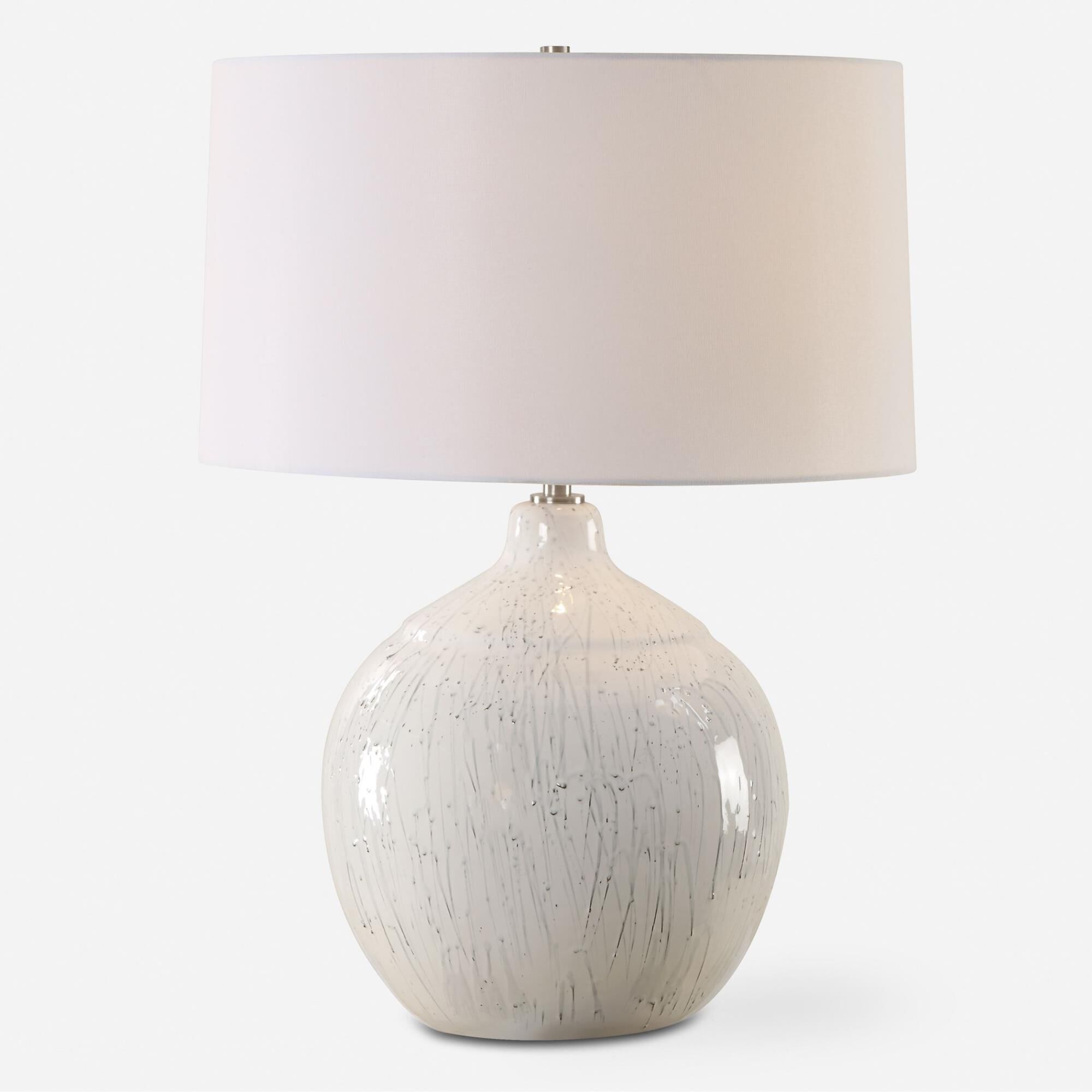 Shown in This Ceramic Table Lamp Features A White Glaze Finish With A Dripped Gray Texture, Paired With Plate finish and Round Hardback shade