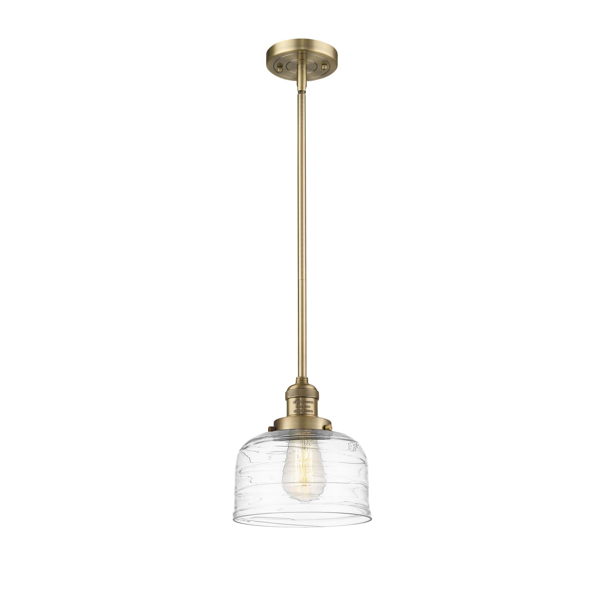 Shown in Brushed Brass finish and Clear Deco Swirl Large Bell glass